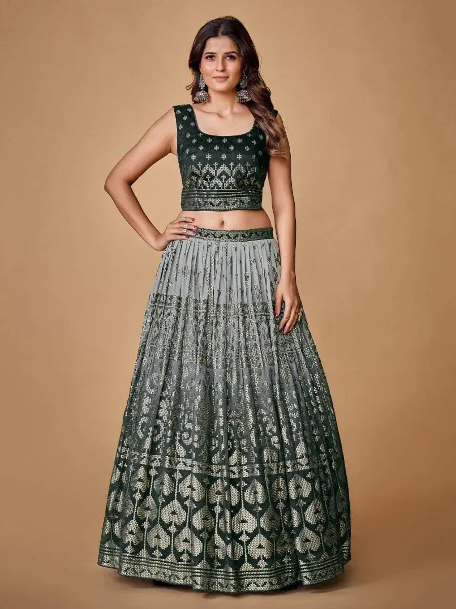 Green and grey embroidered lehenga choli with sleeveless crop top and flared skirt, perfect for Indian ethnic wear.