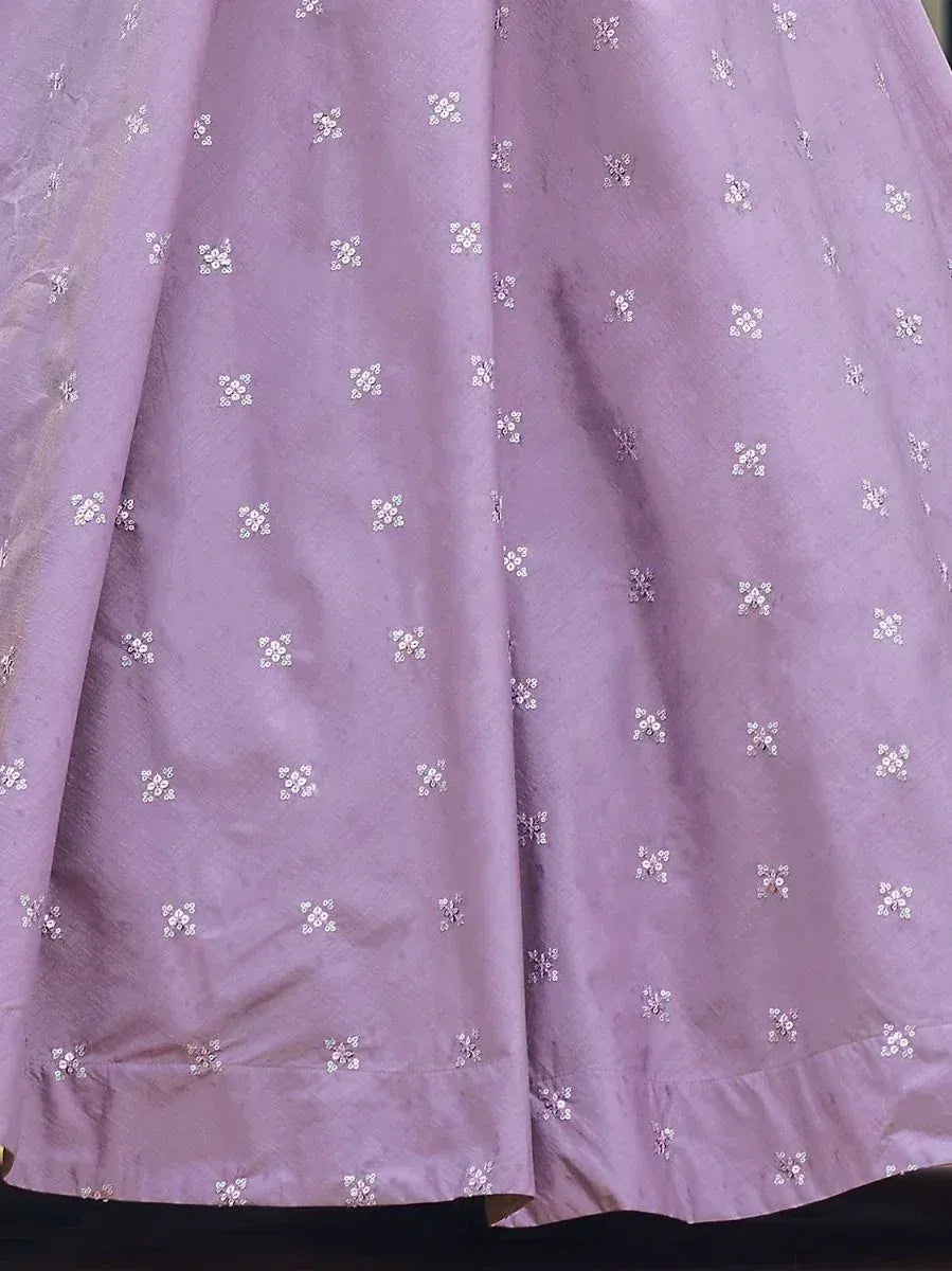 Lavender ethnic gown with delicate white floral embroidery, perfect for Indian festive wear