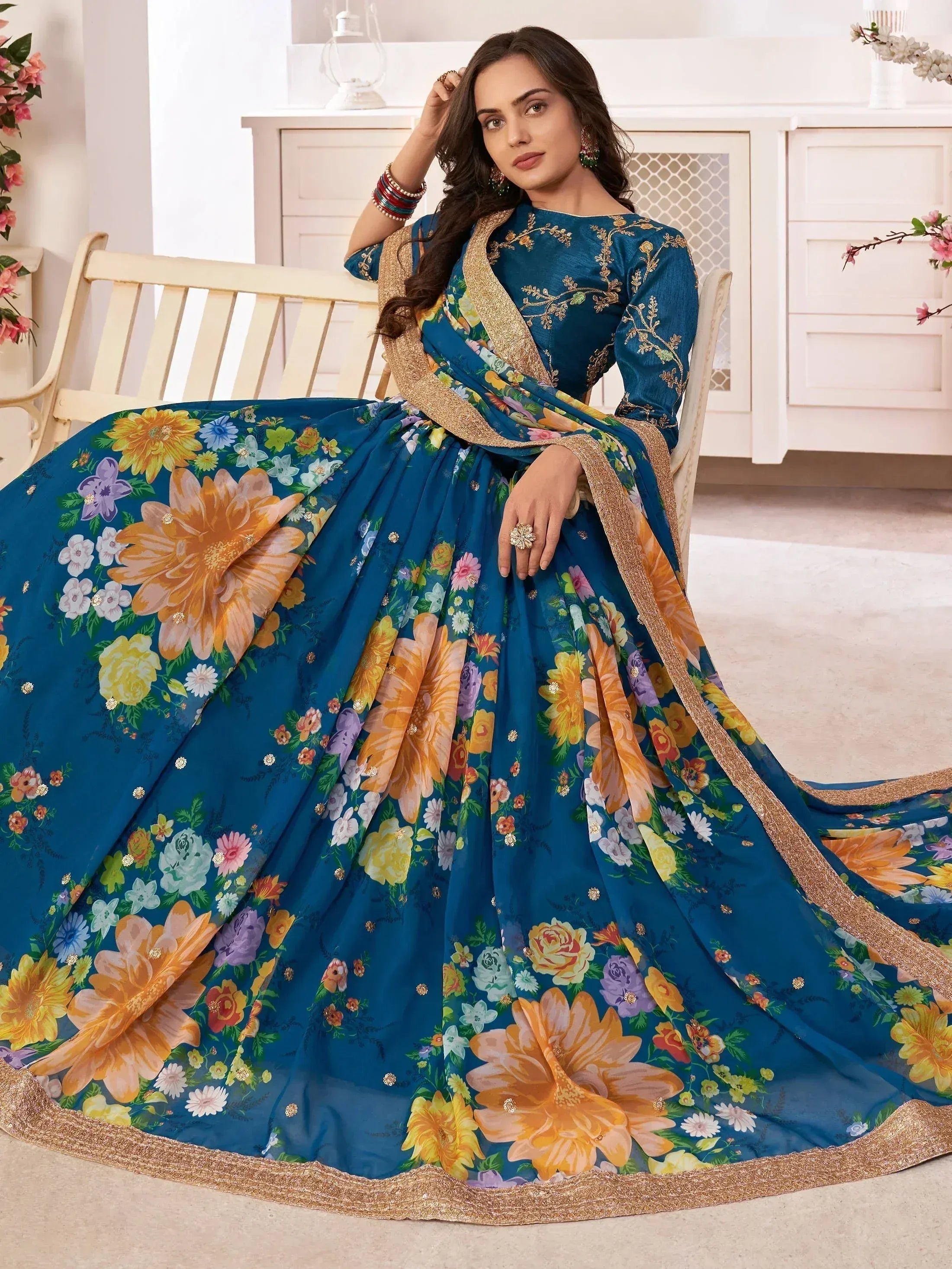 Teal floral print lehenga choli with gold embroidery, perfect for Indian ethnic wear occasions