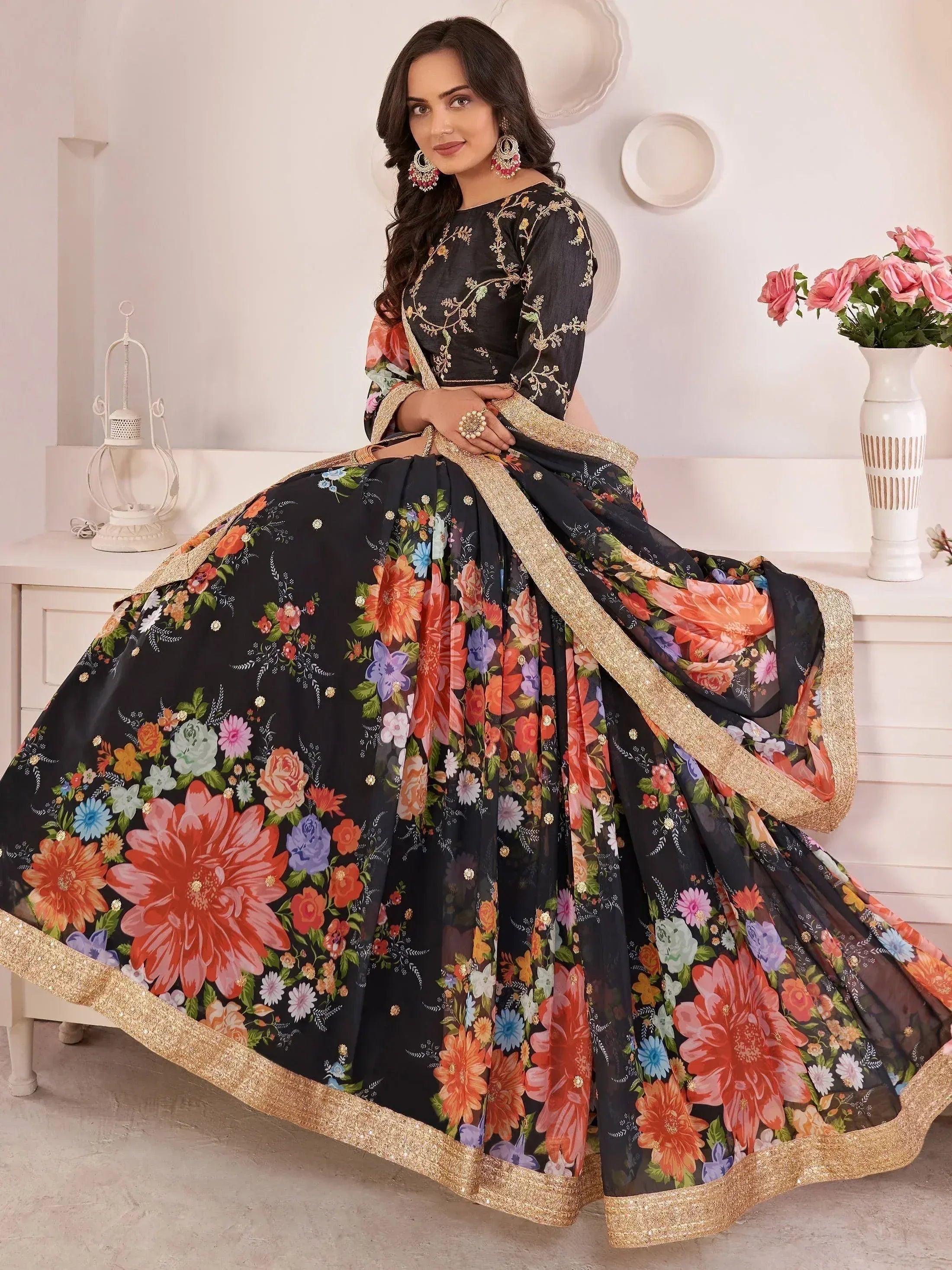 Black floral print lehenga choli with gold trim, ethnic Indian wear for women