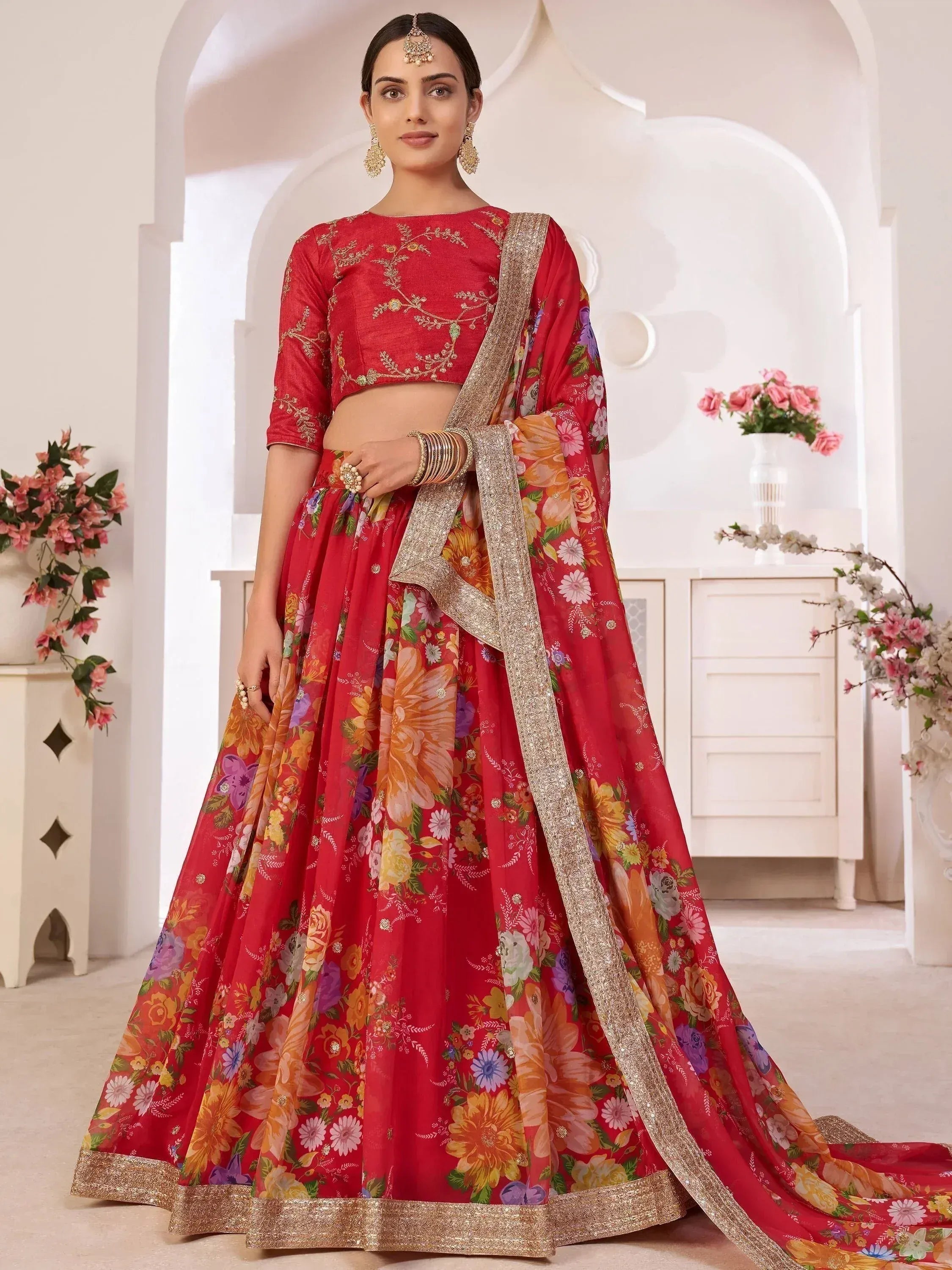 Red floral lehenga choli with gold embroidery, perfect for Indian weddings and festive occasions