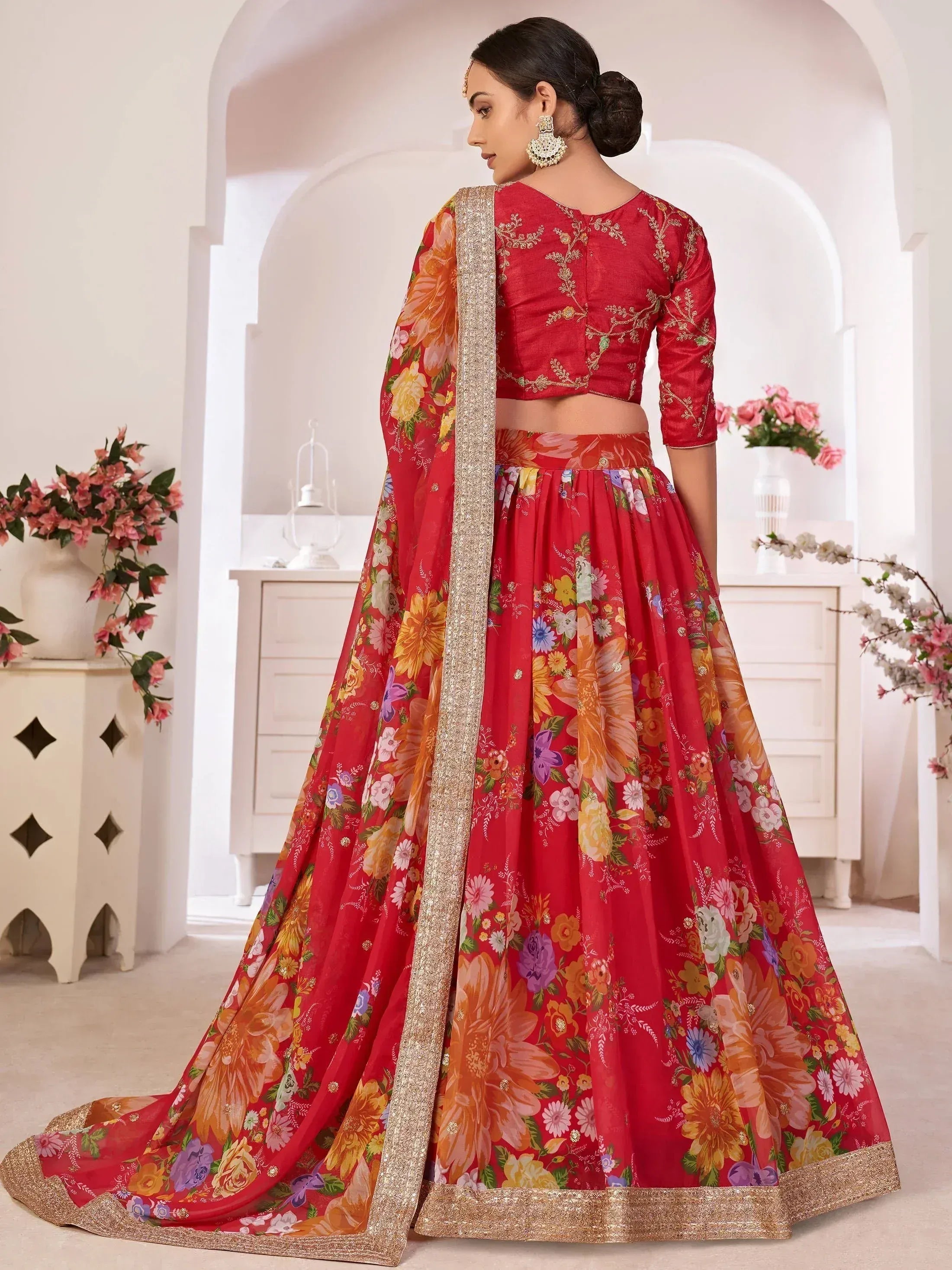 Red floral lehenga choli with gold embroidery, perfect for Indian weddings and festive occasions