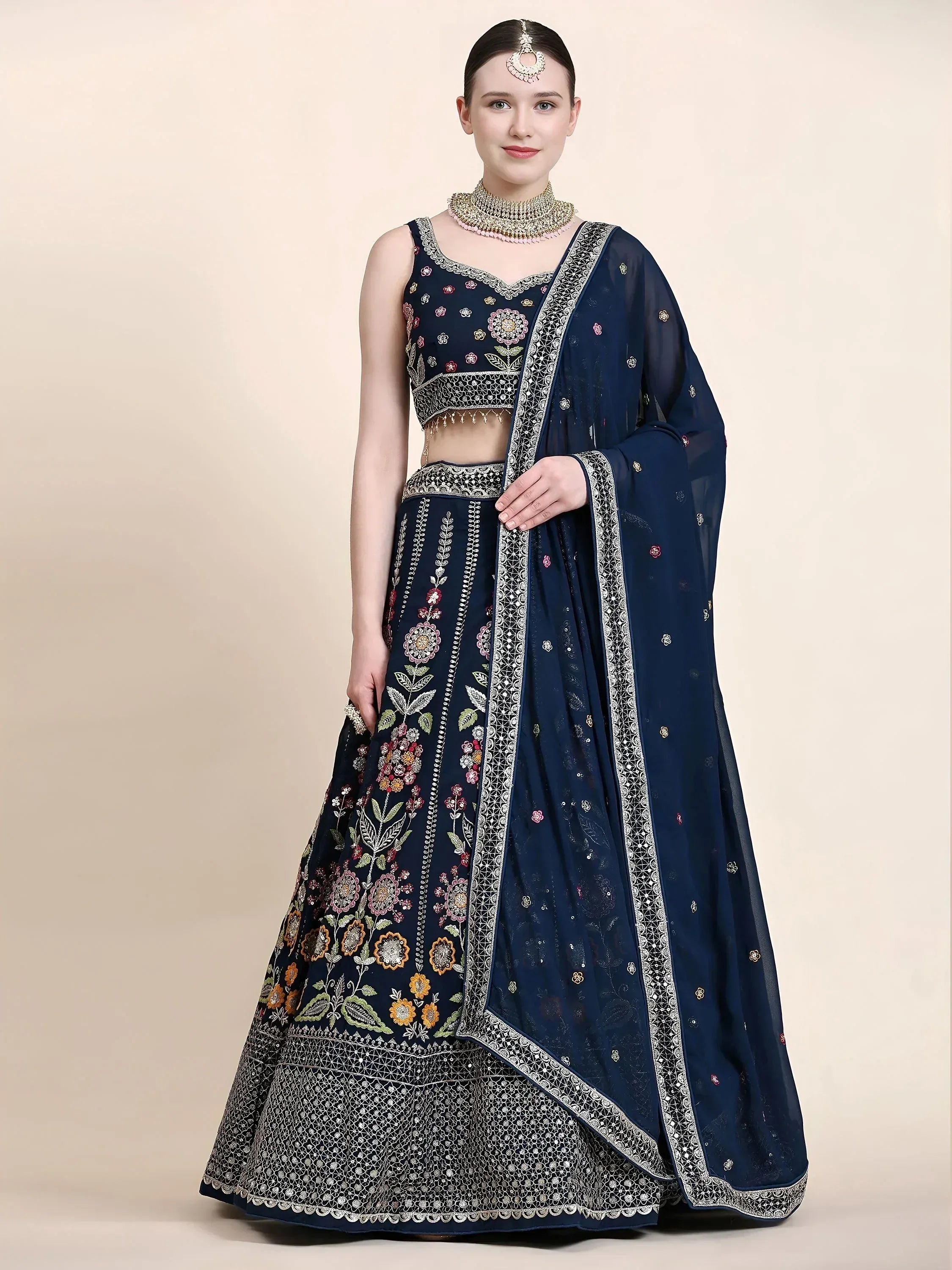 Navy blue embroidered lehenga choli with floral designs and matching dupatta for Indian ethnic wear