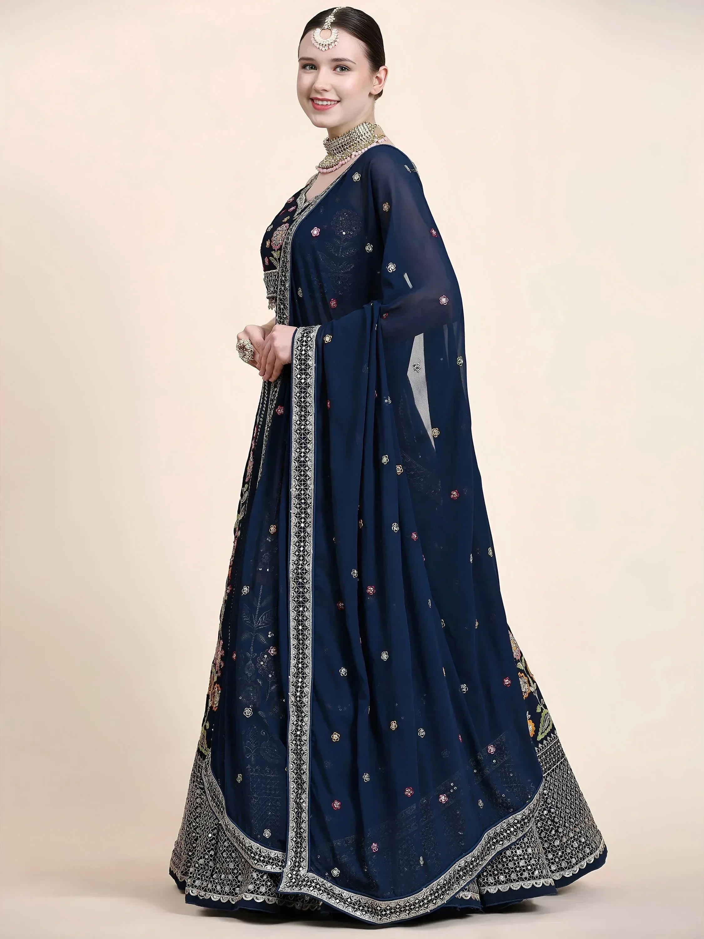 Navy blue embroidered lehenga choli with floral motifs and silver border, perfect for Indian ethnic occasions