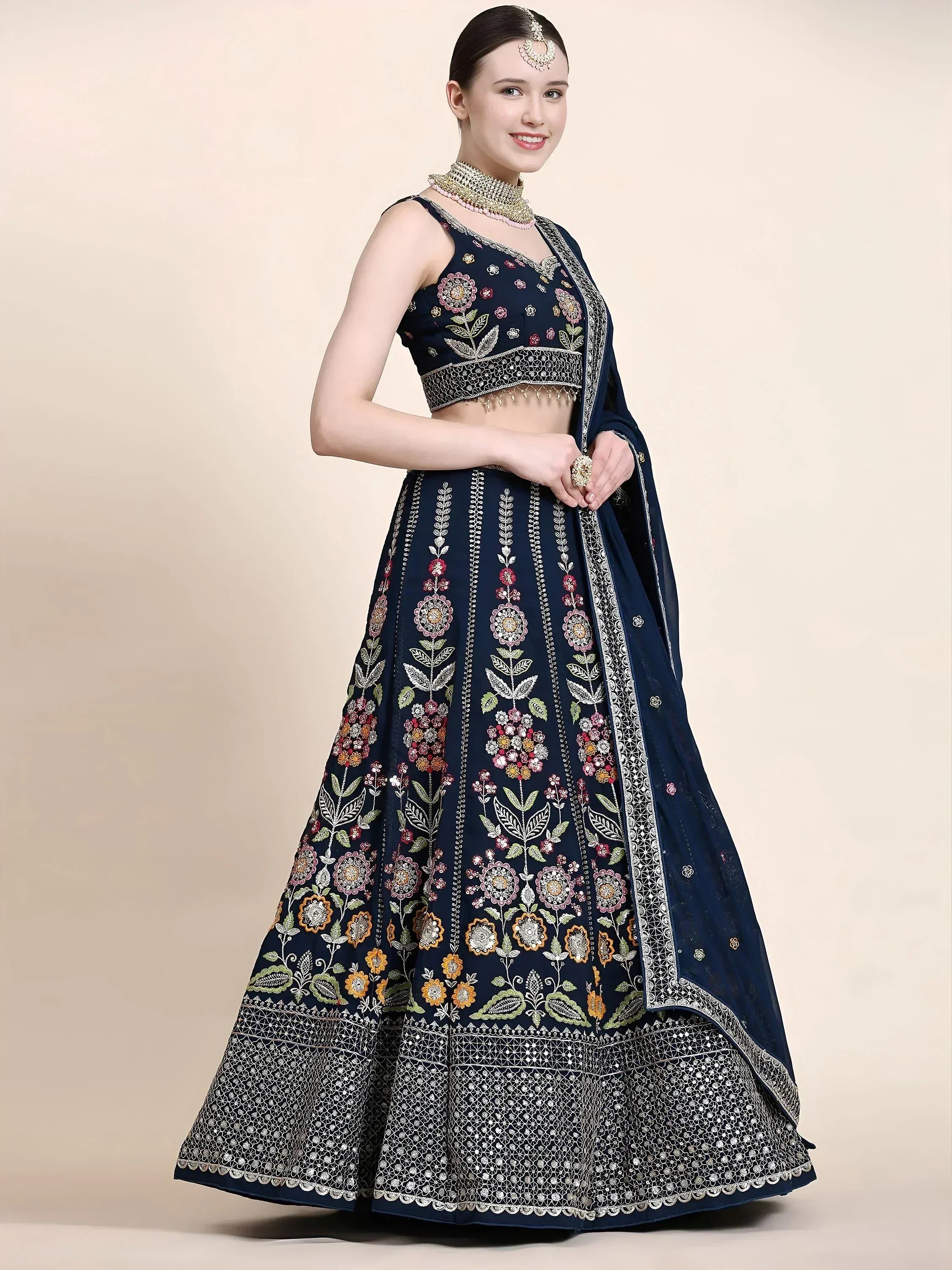 Navy blue embroidered lehenga choli with floral motifs and dupatta, perfect for Indian ethnic wear occasions