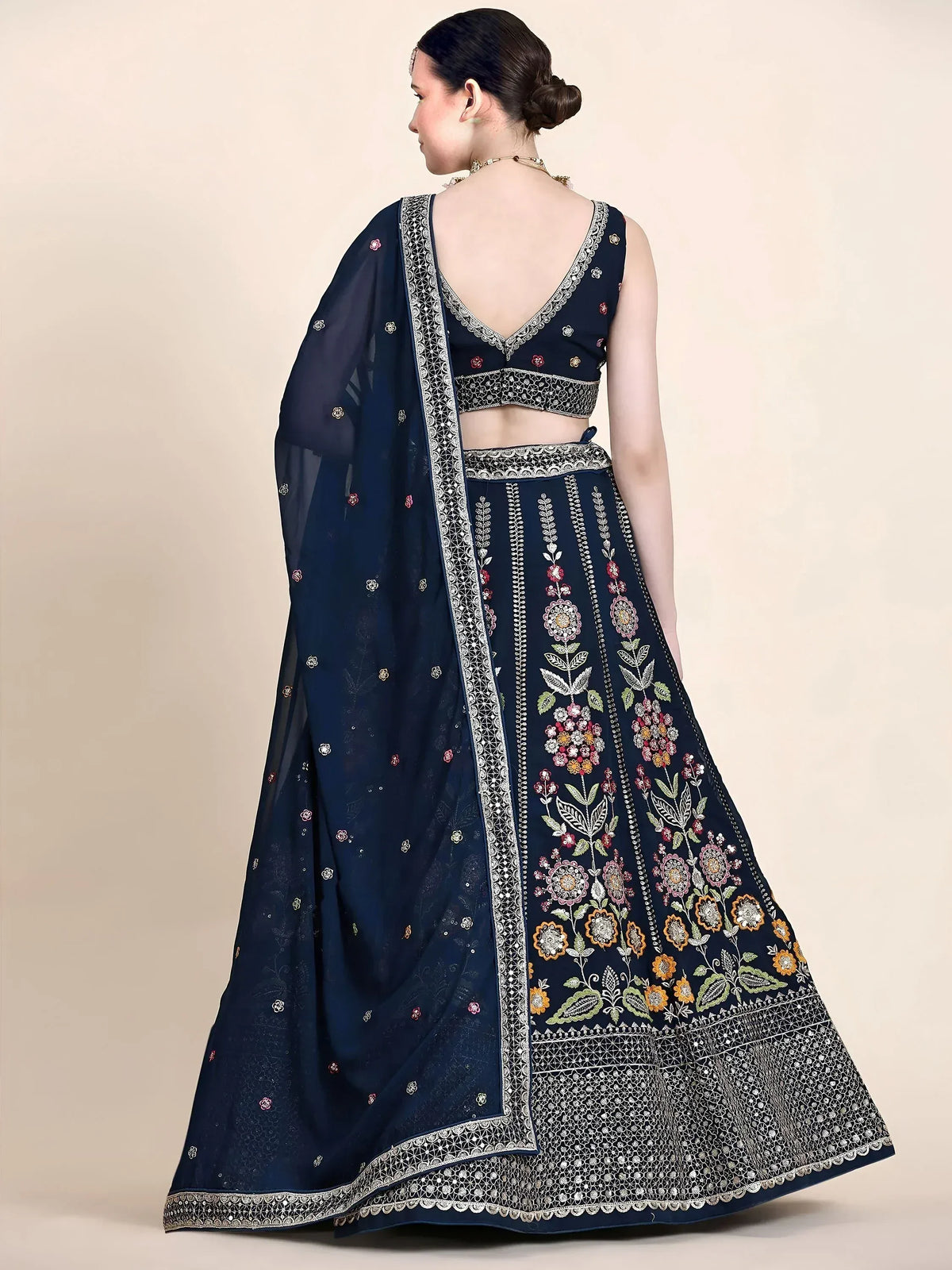 Navy blue embroidered lehenga choli with floral motifs and matching dupatta, ideal for Indian ethnic occasions.