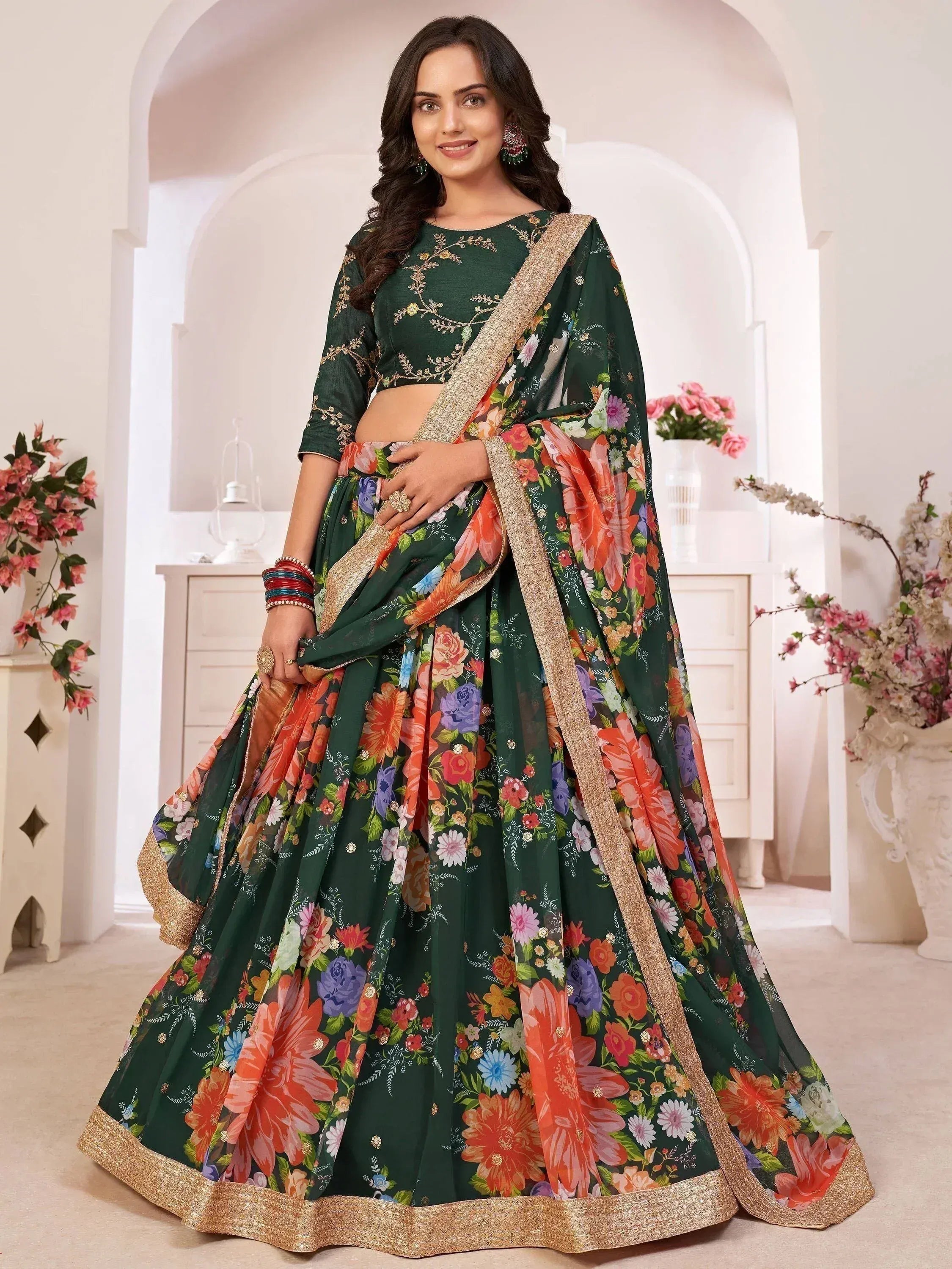 Green floral lehenga choli with gold trim, perfect for Indian ethnic wear and festive occasions.