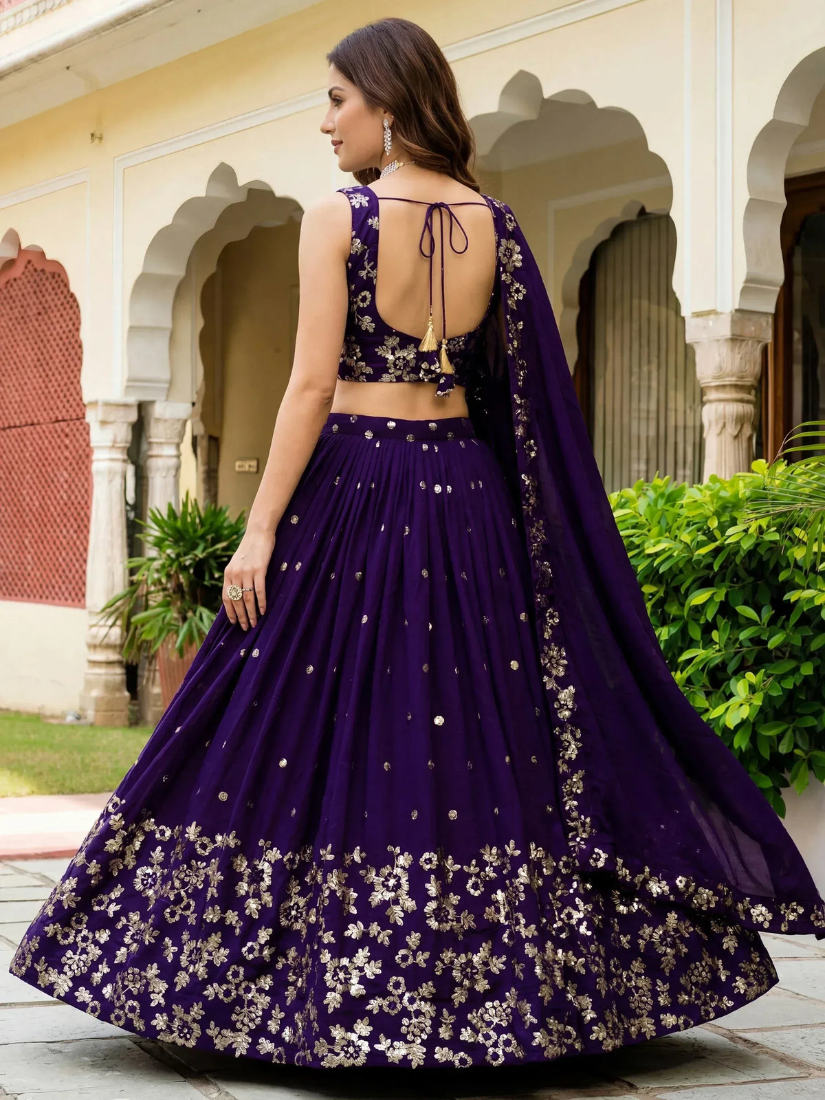 Purple designer lehenga choli with gold floral embroidery, back view, ethnic wear