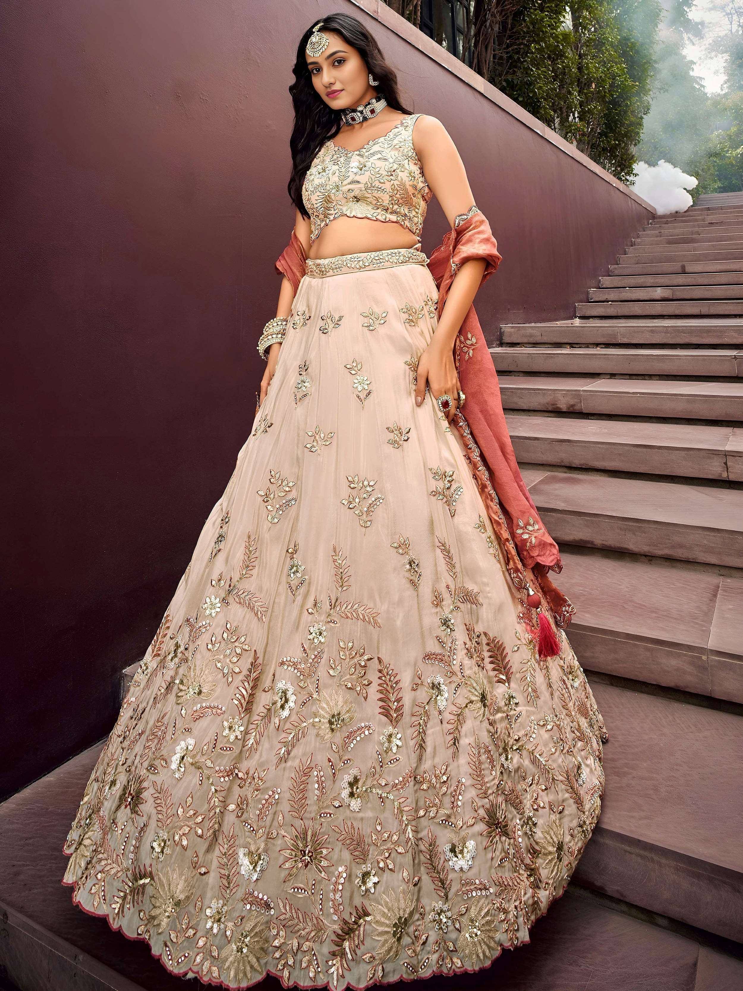 Beige floral embroidered lehenga choli with dupatta, perfect for Indian weddings and festive occasions.