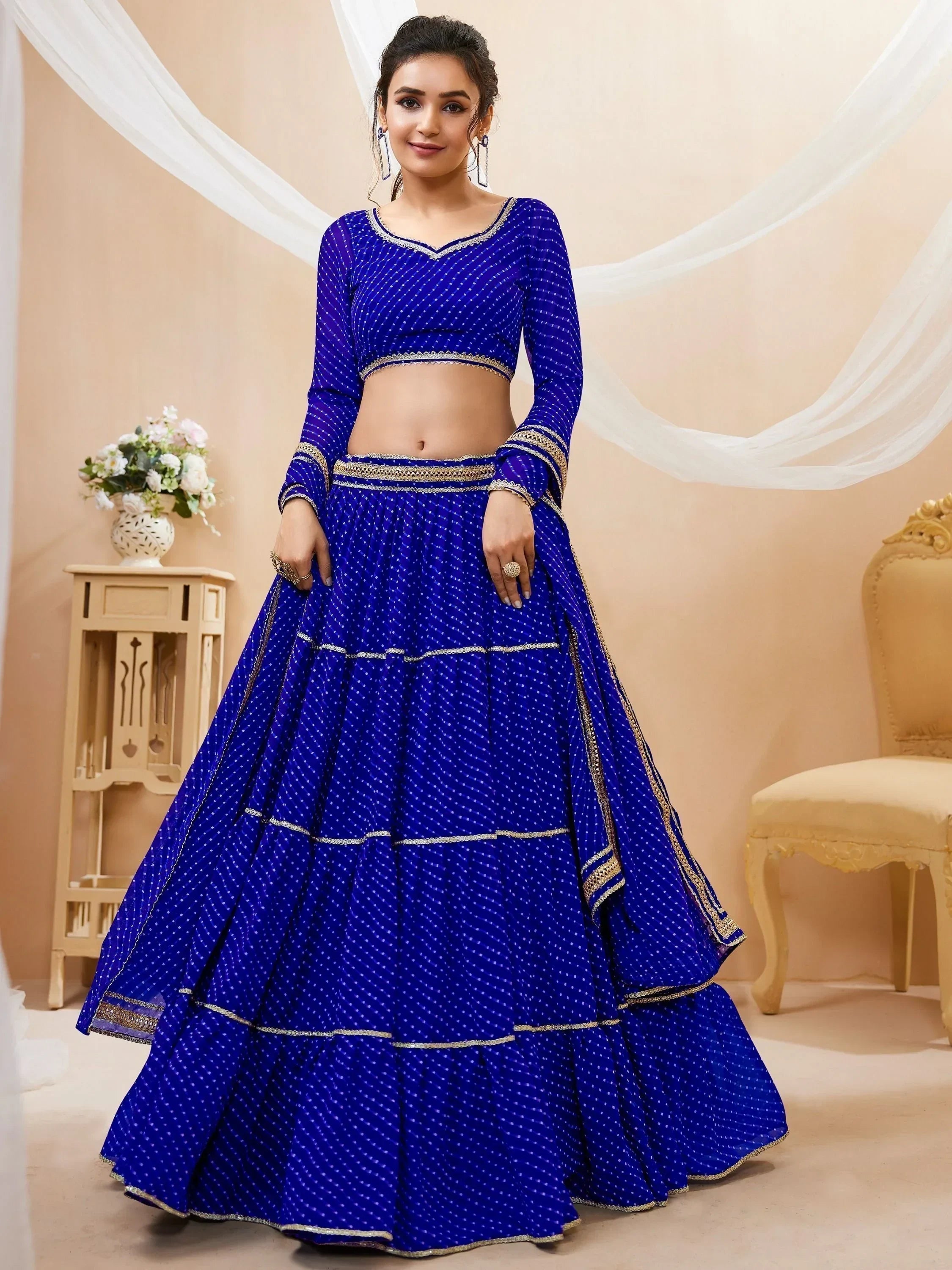 Royal blue designer lehenga choli with gold trim, perfect for Indian ethnic wear occasions