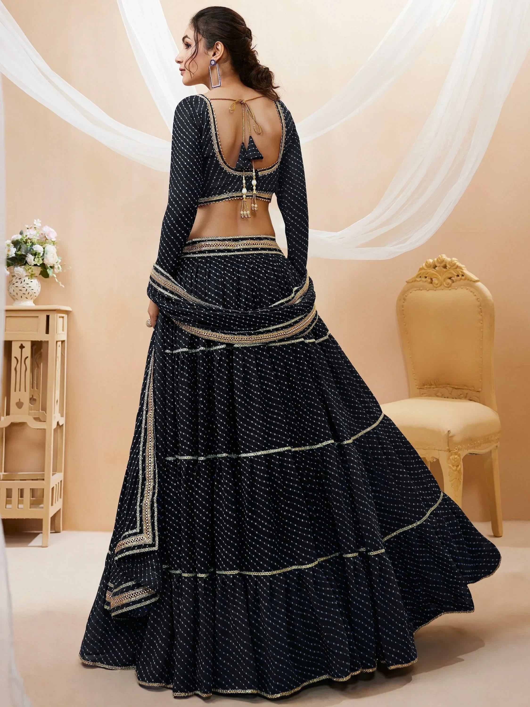 Black polka dot lehenga choli with gold embroidery, back view, ethnic Indian wear