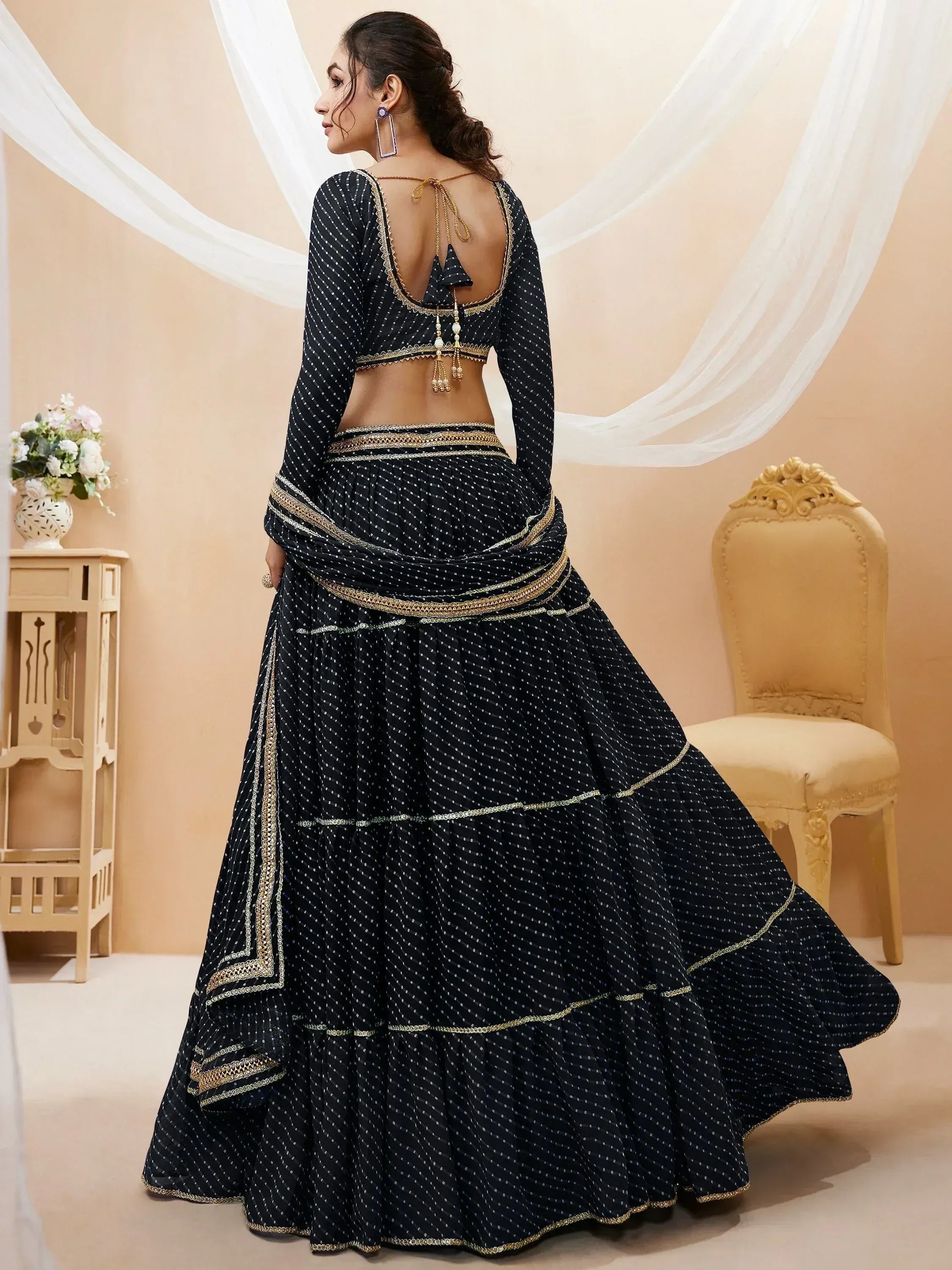 Black polka dot lehenga choli with gold embroidery, back view, ethnic Indian wear