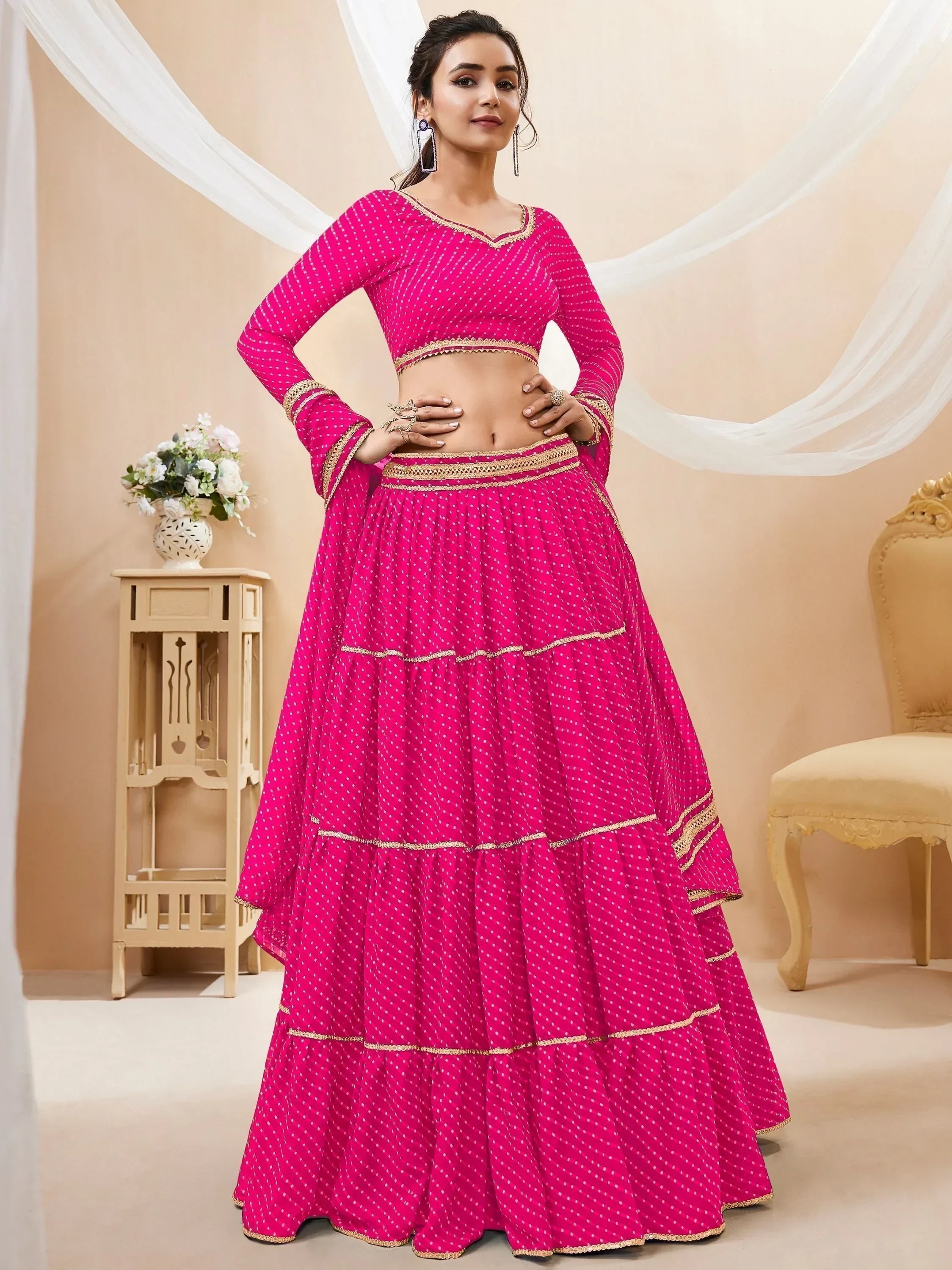 Fuchsia polka dot lehenga choli with gold trim, Indian ethnic wear for women