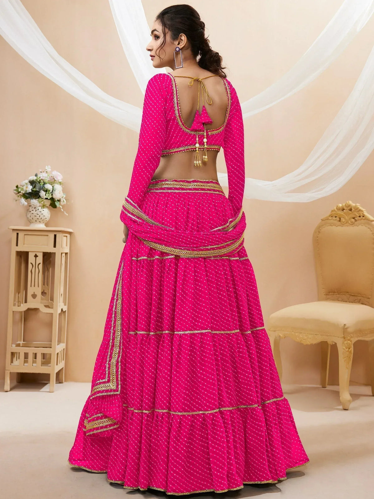 Pink polka dot lehenga choli with gold embroidery and open back design, Indian ethnic wear