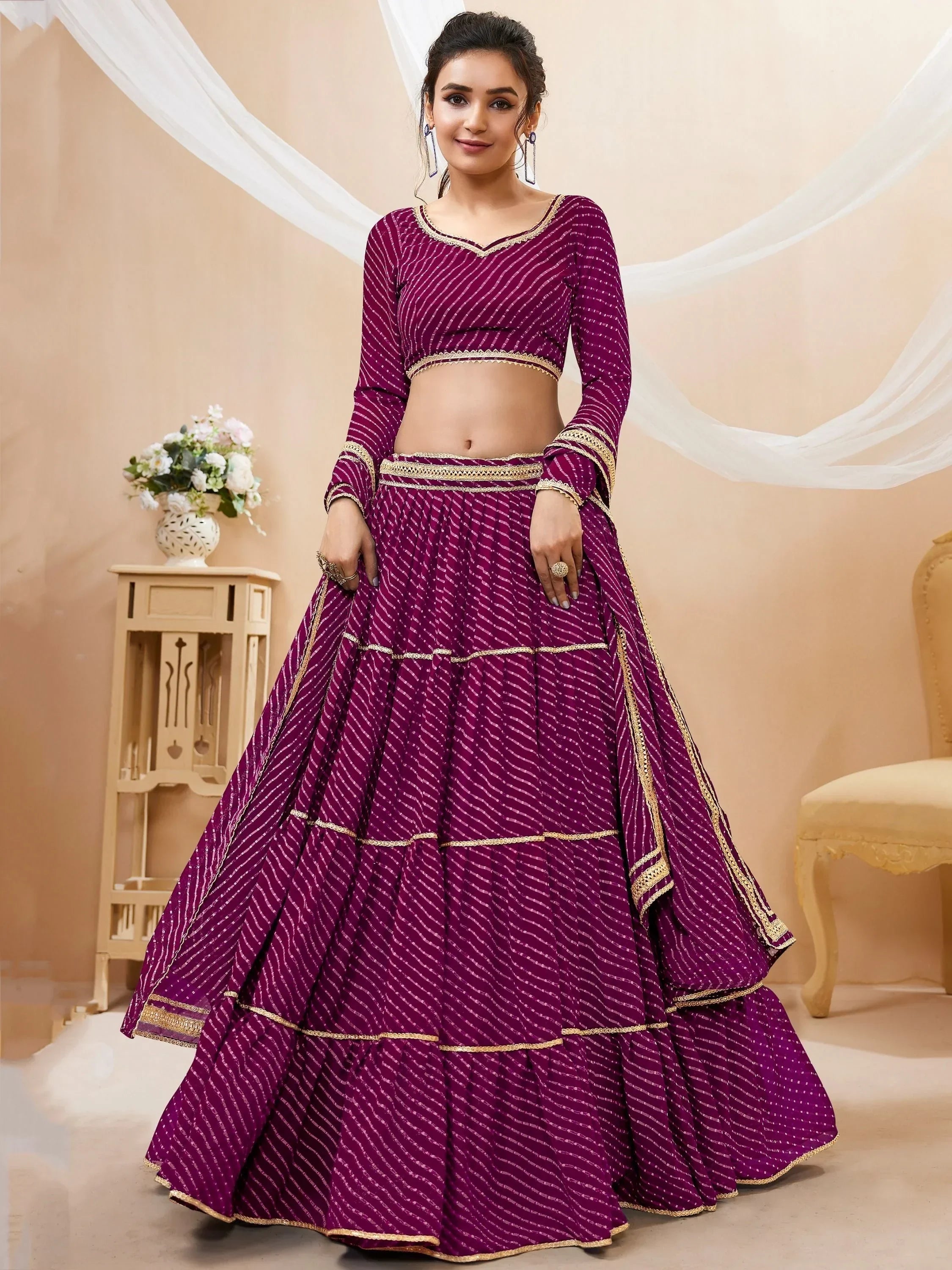 Purple ethnic lehenga choli with gold trim, perfect for Indian weddings and festive occasions