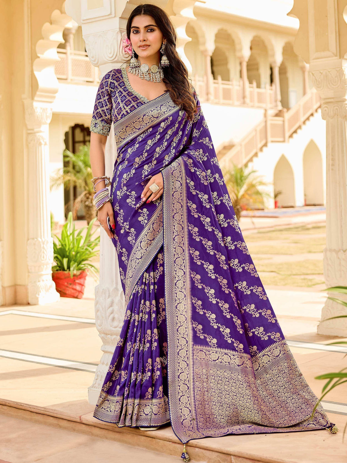 Purple designer saree with gold embroidery, perfect for Indian ethnic wear and festive occasions.
