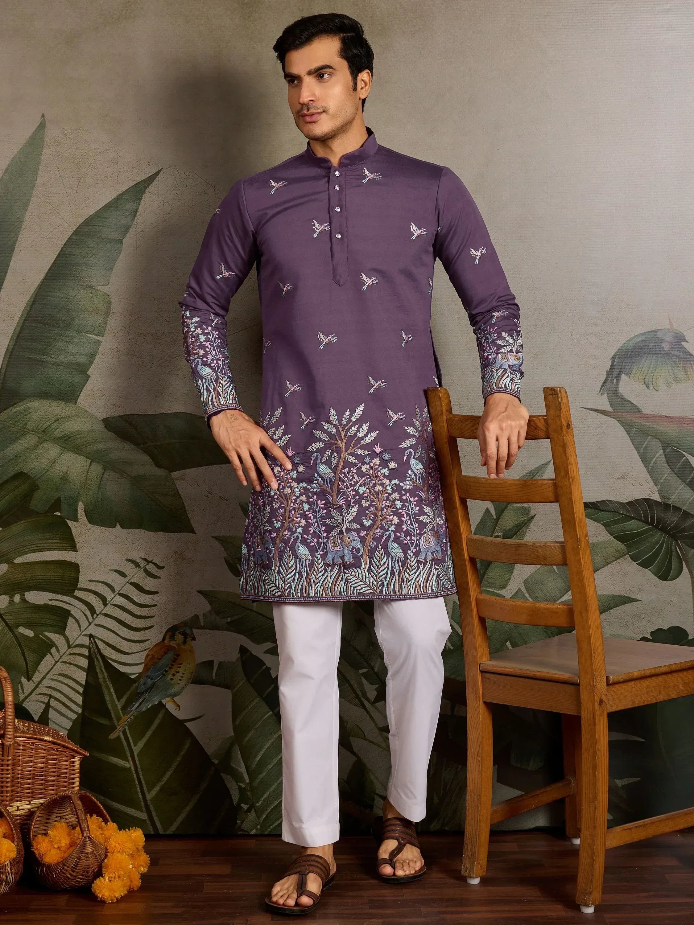 Purple embroidered kurta with bird and tree motifs, paired with white pants for men's ethnic wear