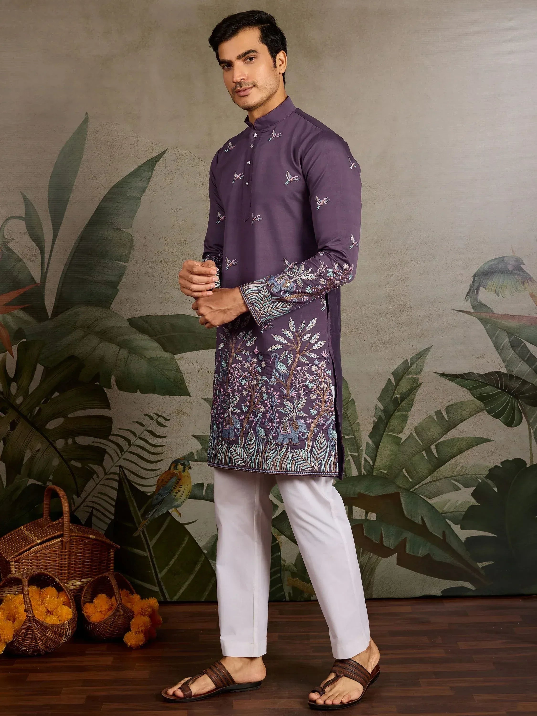 Purple embroidered kurta with bird and tree motifs, paired with white pants for men's ethnic wear.