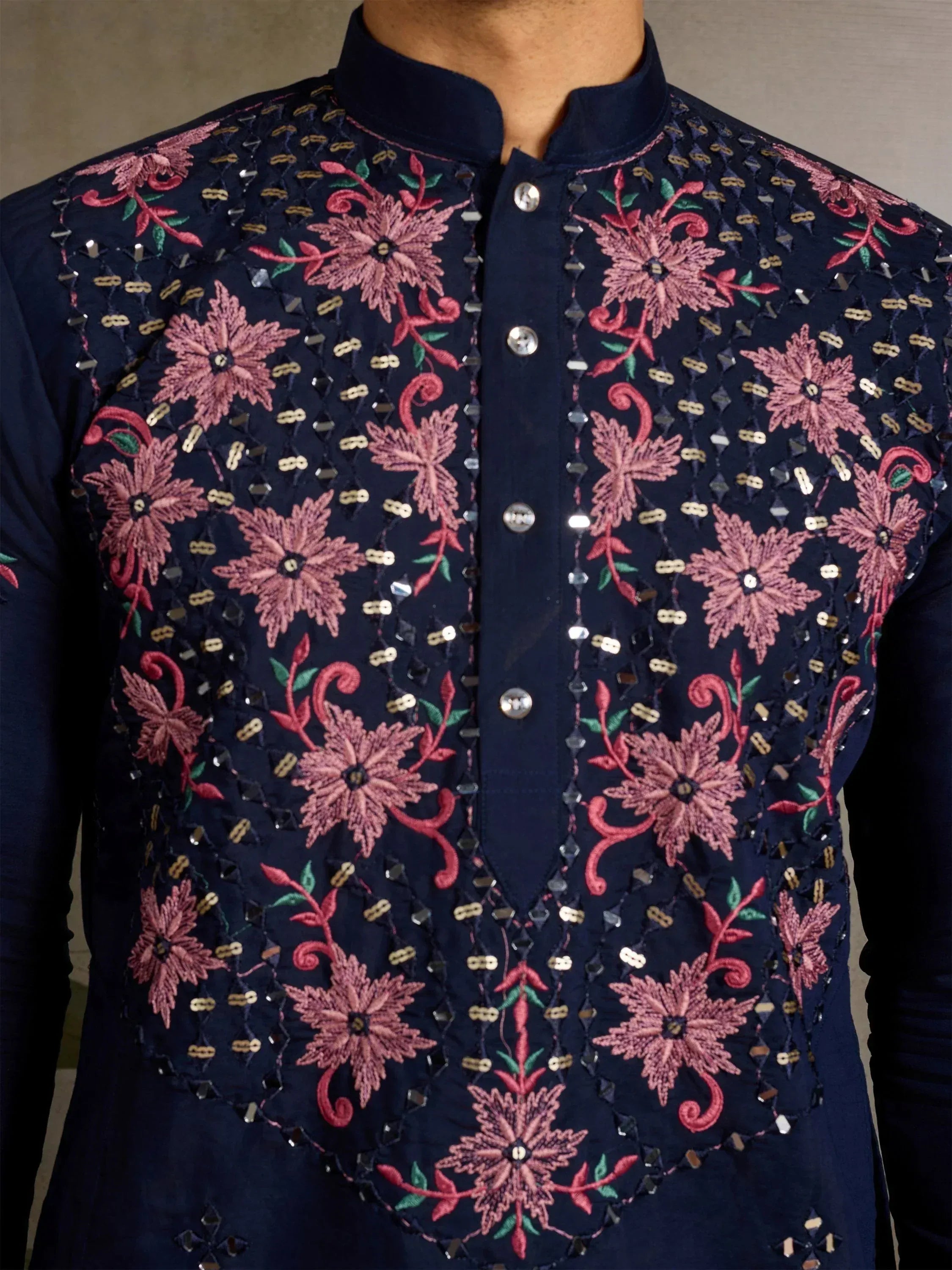 Navy blue kurta with pink floral embroidery and mirror work, traditional Indian ethnic wear