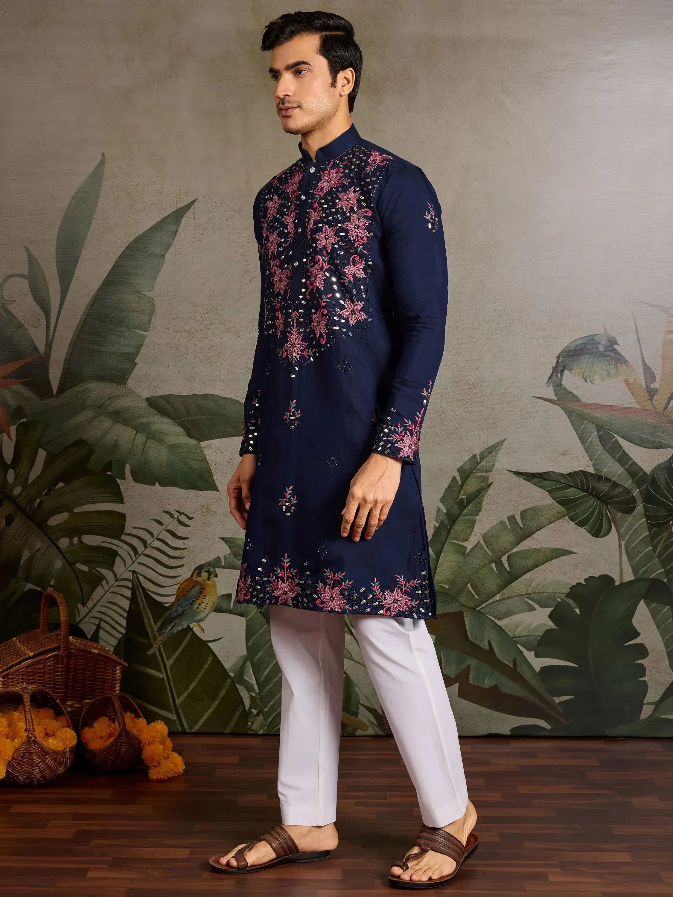 Navy blue embroidered kurta with pink floral motifs, paired with white pants for men's ethnic wear