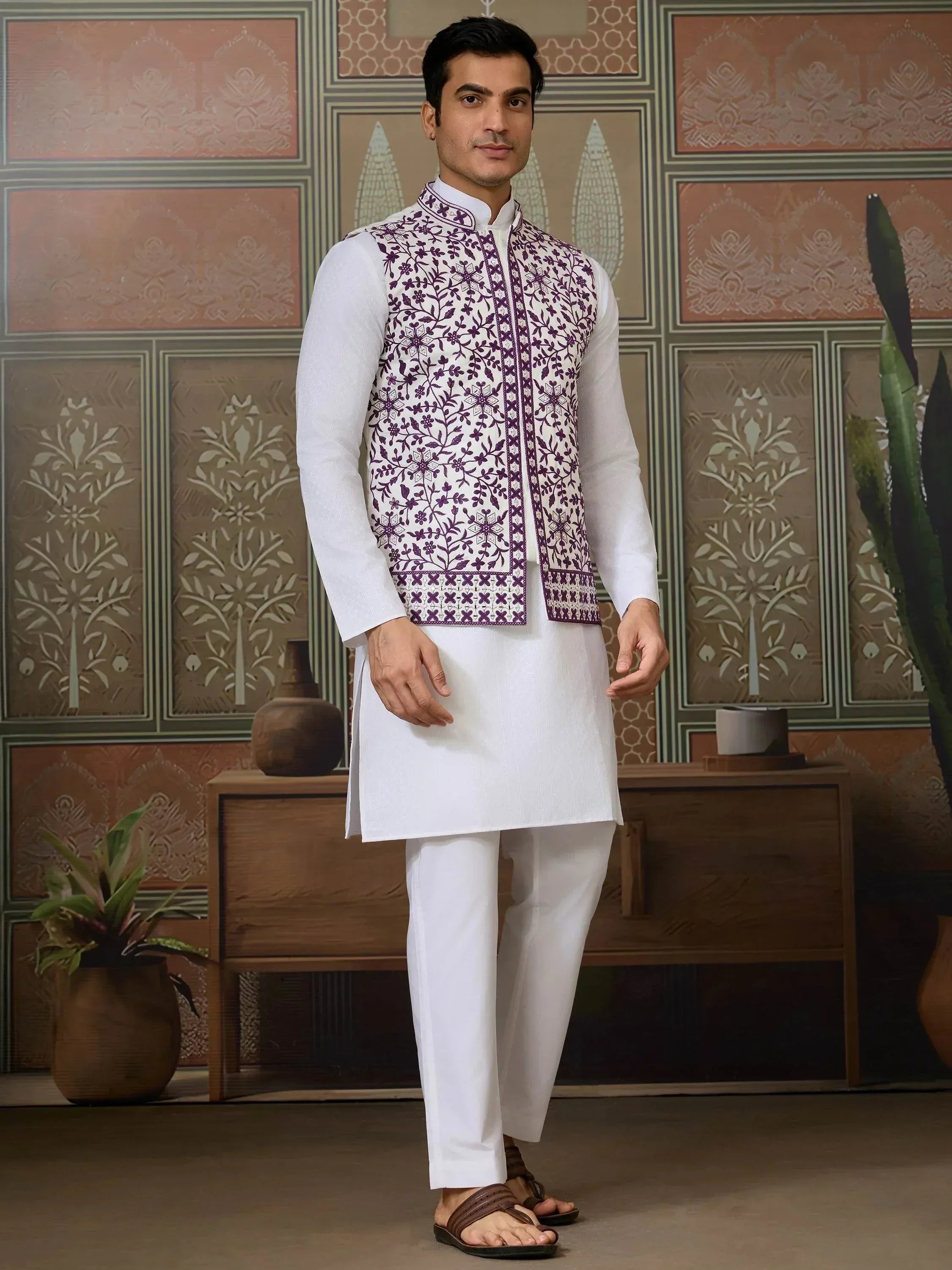 Men's white kurta set with purple floral embroidered vest, ethnic wear for festive occasions