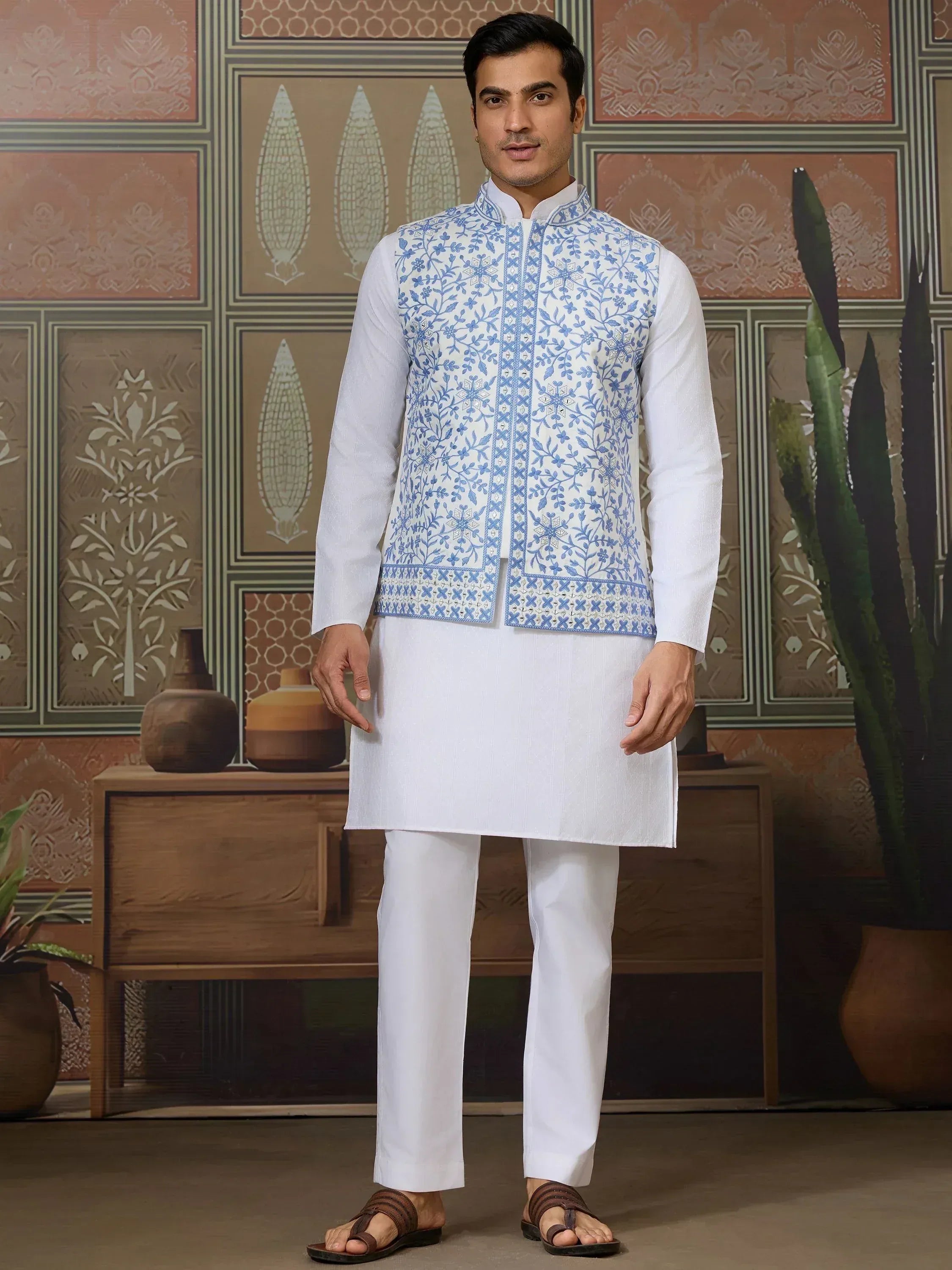Men's white kurta set with blue floral embroidered vest, ethnic Indian wear for festive occasions