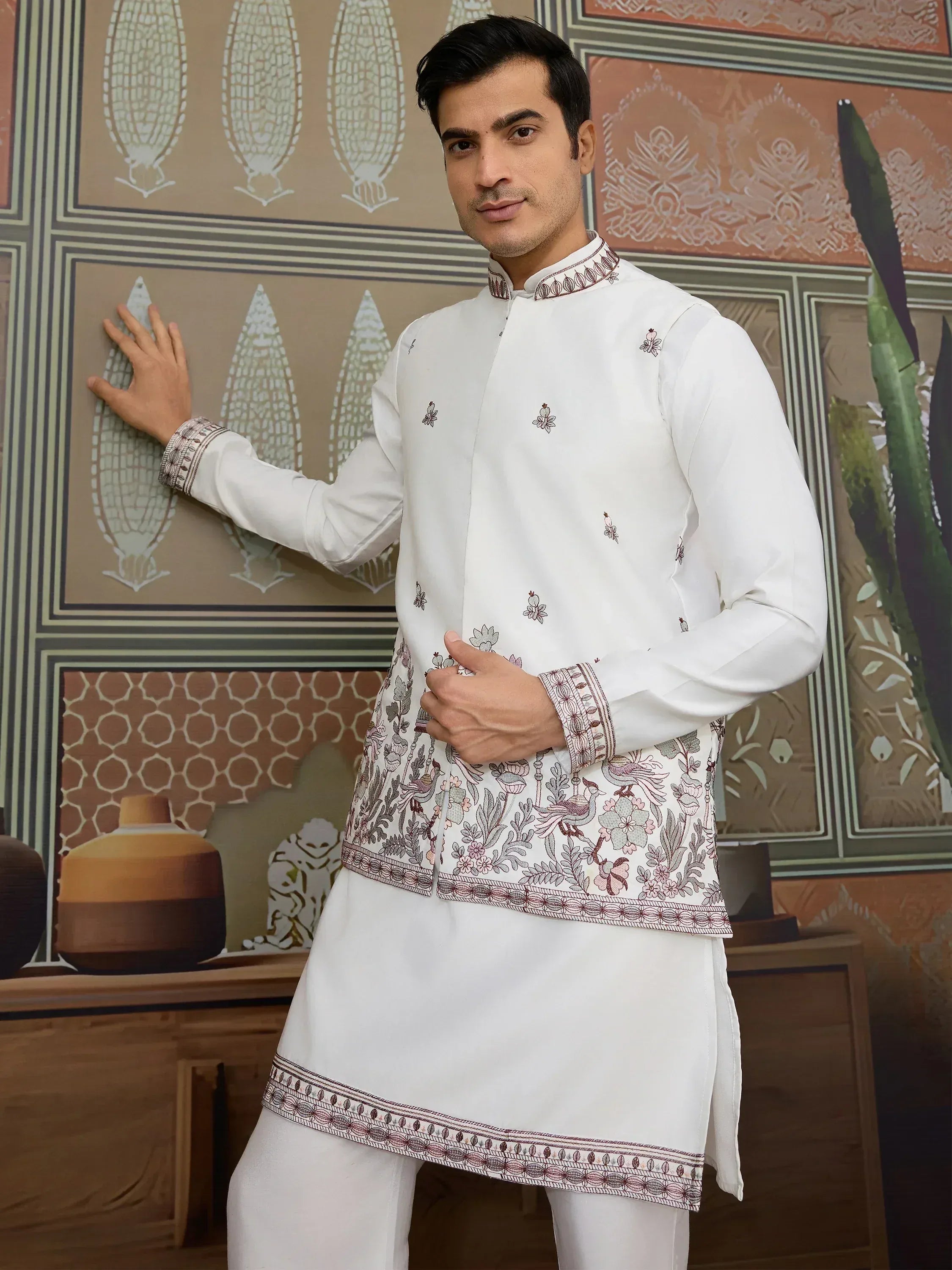 White embroidered kurta with floral and bird motifs, traditional Indian ethnic wear for men