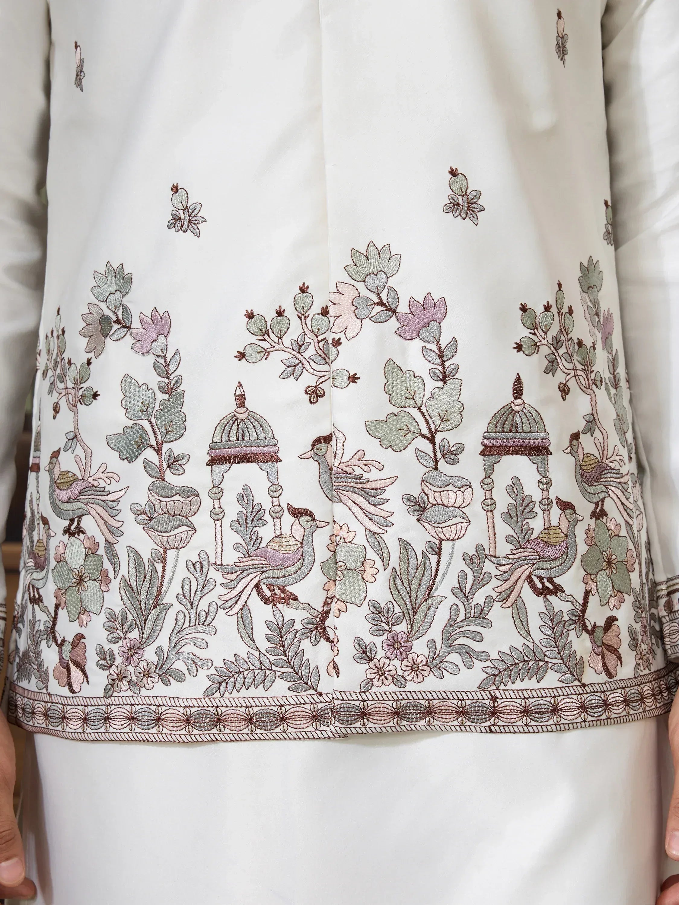 White ethnic kurta with intricate floral and bird embroidery, perfect for Indian wear.