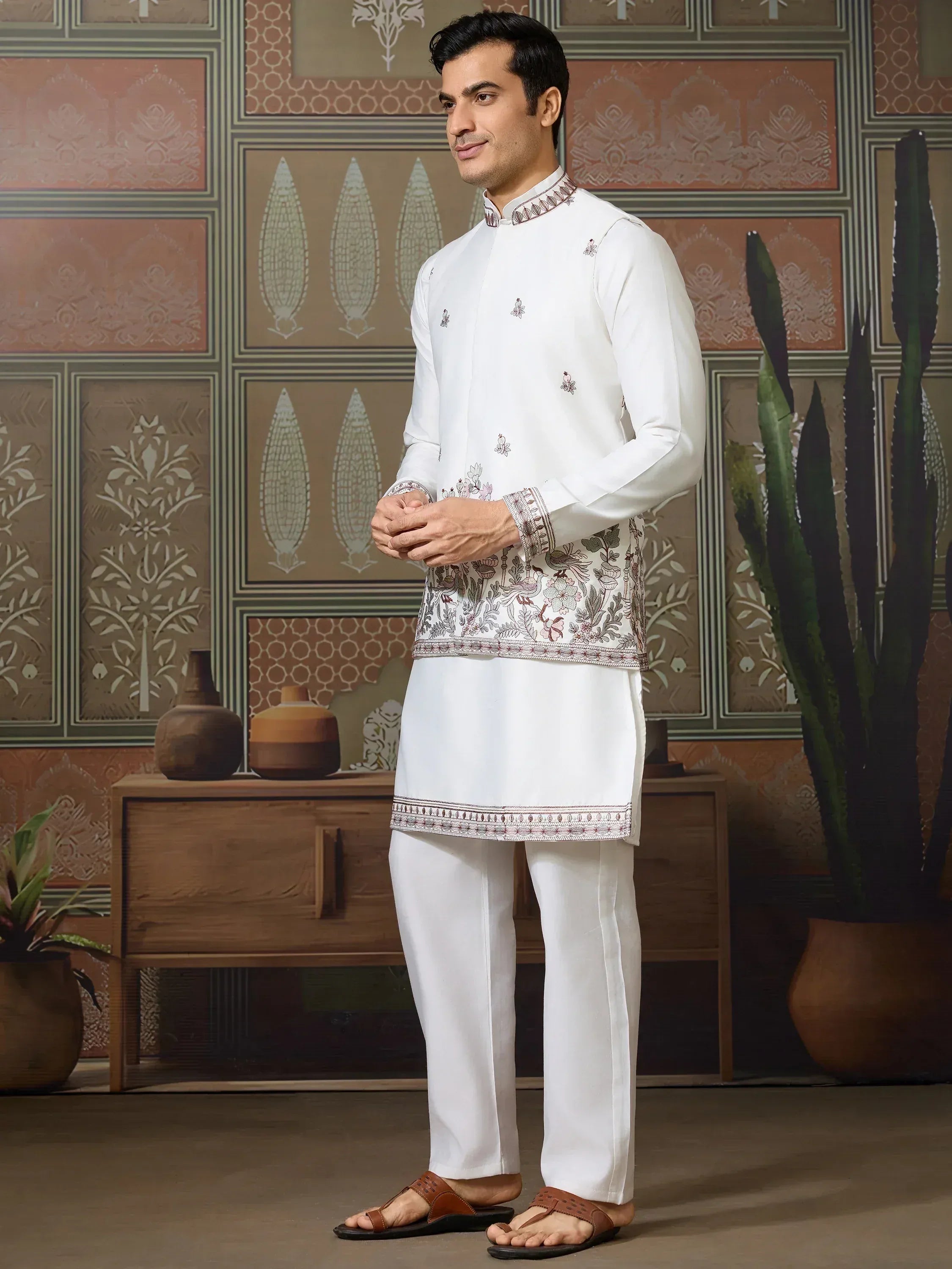White embroidered kurta pajama set with floral patterns, ideal for Indian ethnic wear occasions