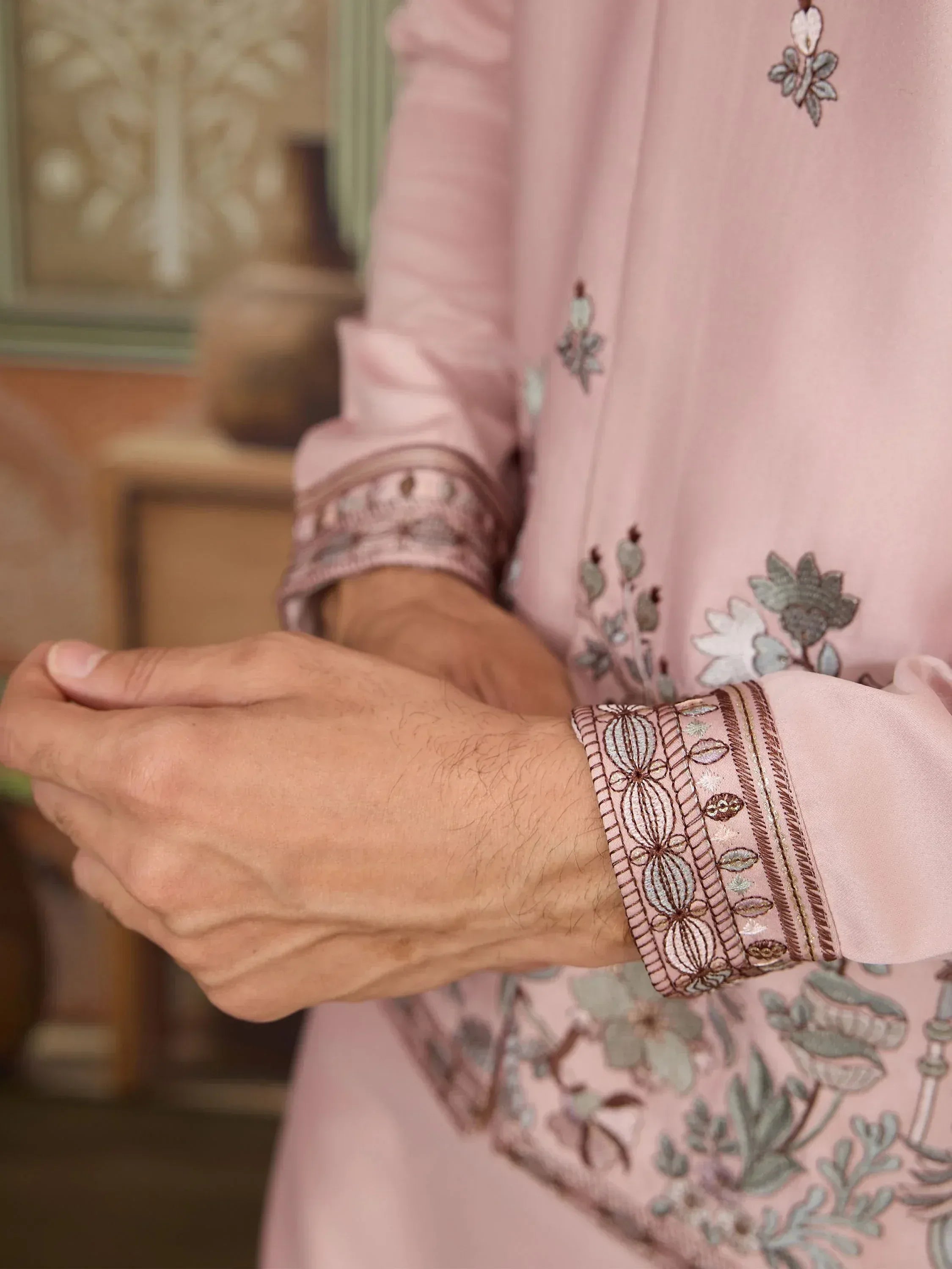 Pink embroidered ethnic kurta with detailed floral cuffs and traditional Indian design