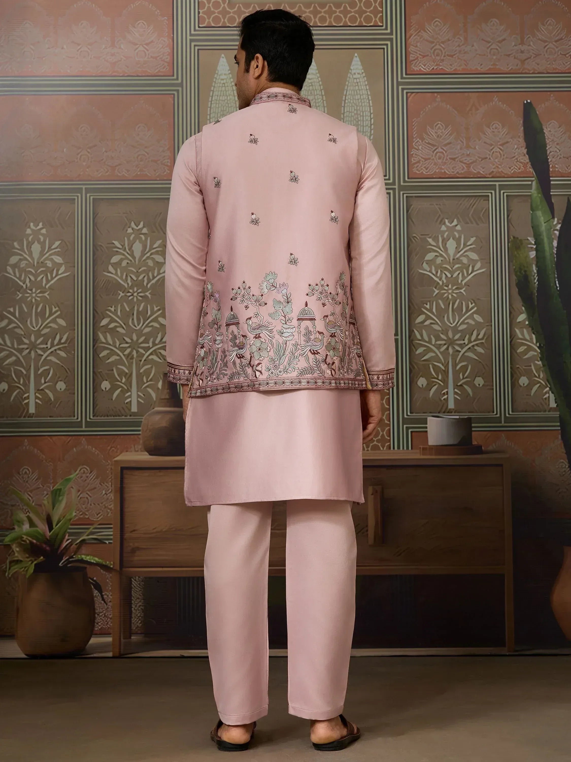 Pink embroidered kurta set with floral and bird motifs, ideal for Indian ethnic occasions