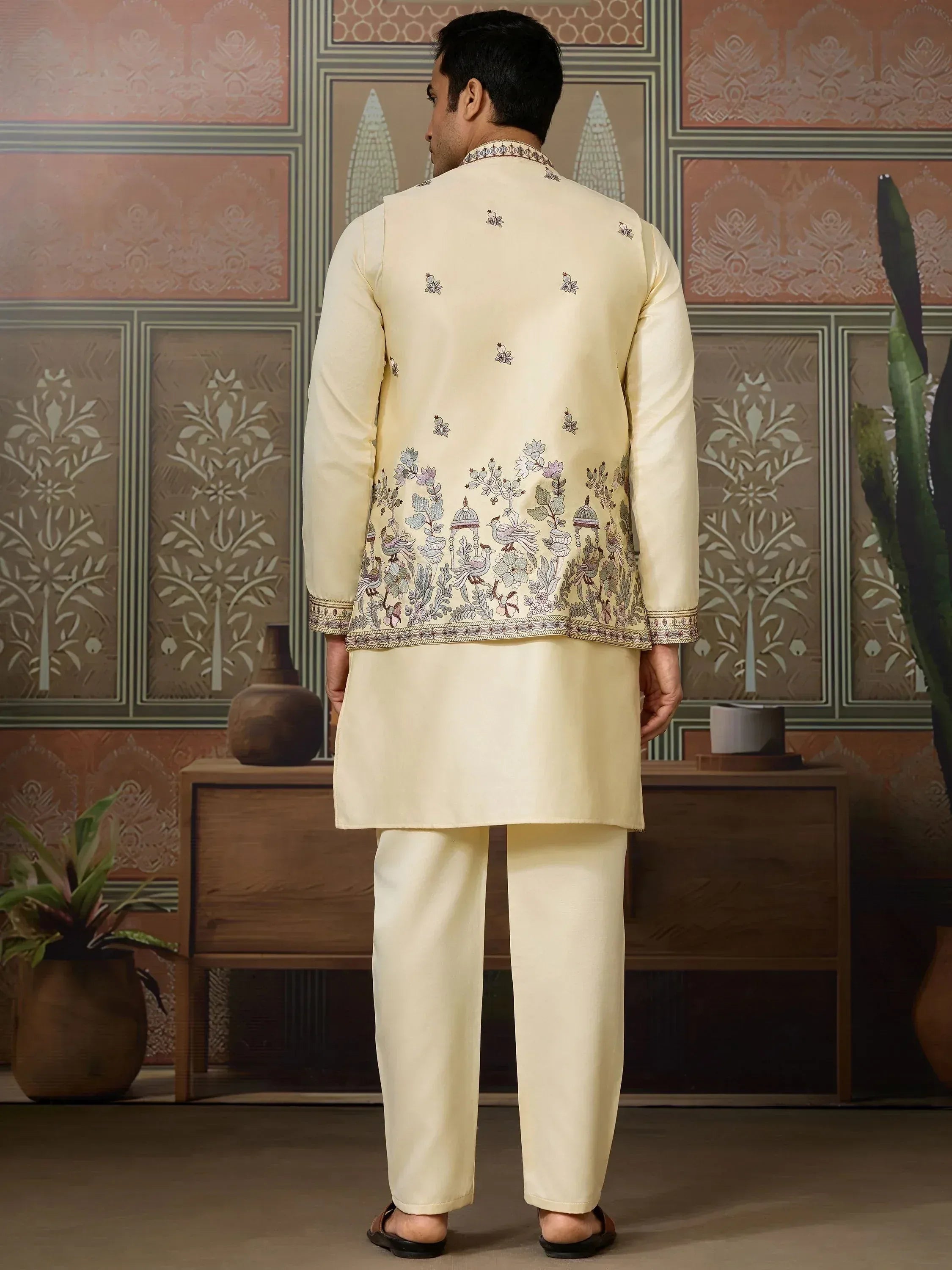 Men's cream embroidered kurta set with floral and bird motifs, ideal for Indian ethnic occasions