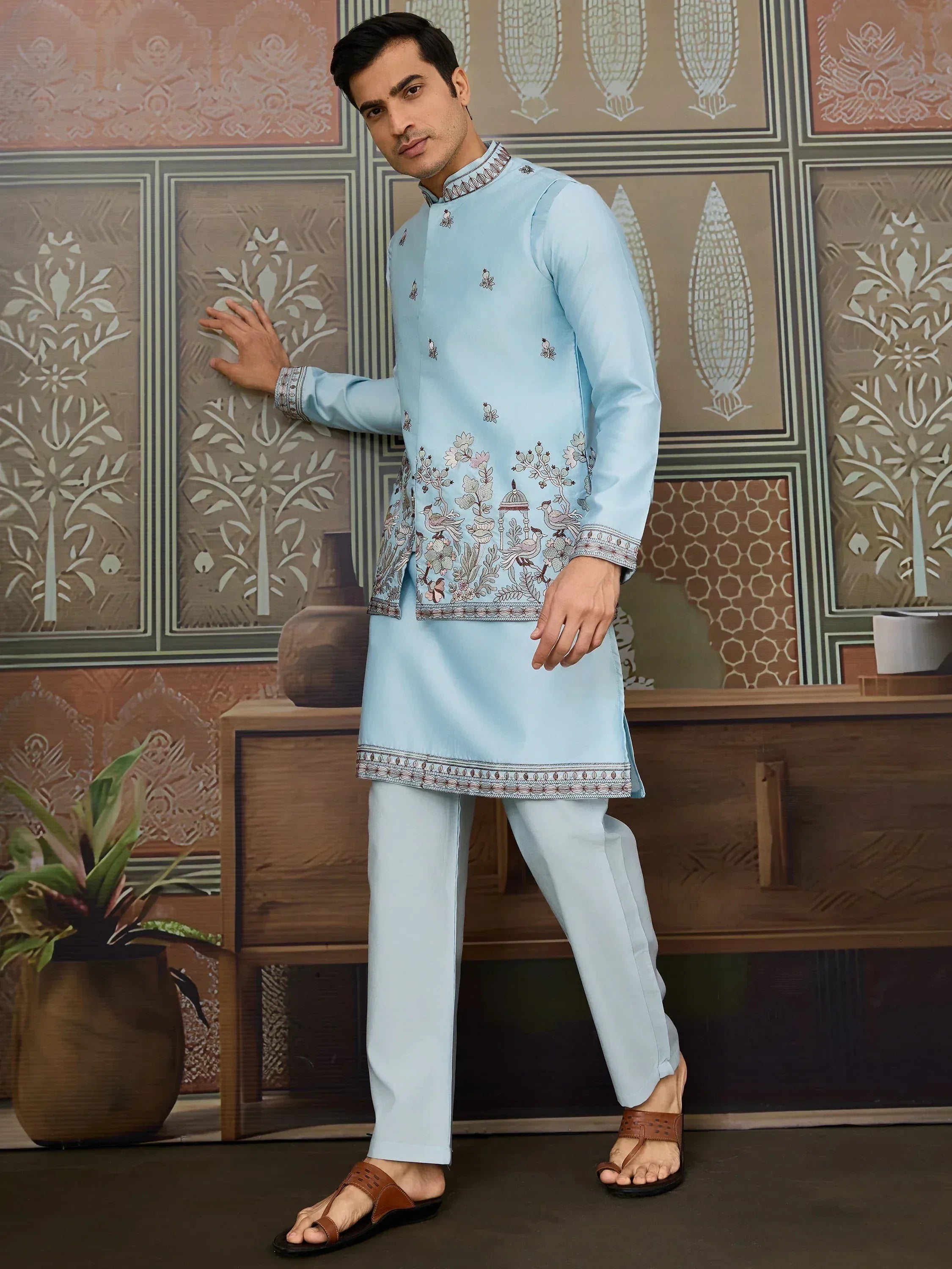 Light blue embroidered kurta set with floral and bird motifs, perfect for Indian ethnic occasions.
