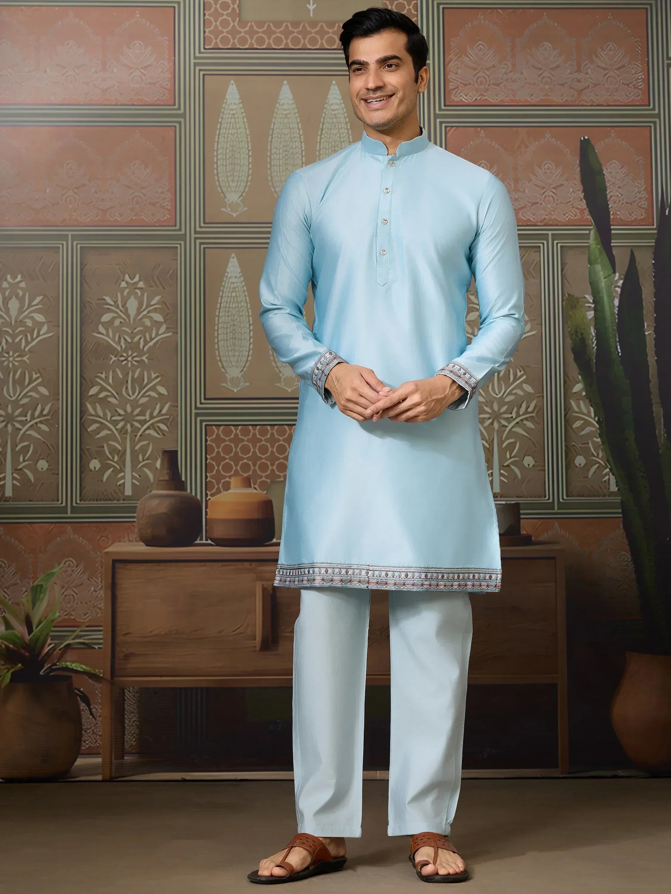Light blue ethnic kurta set with embroidered hem and cuffs, perfect for Indian festive occasions