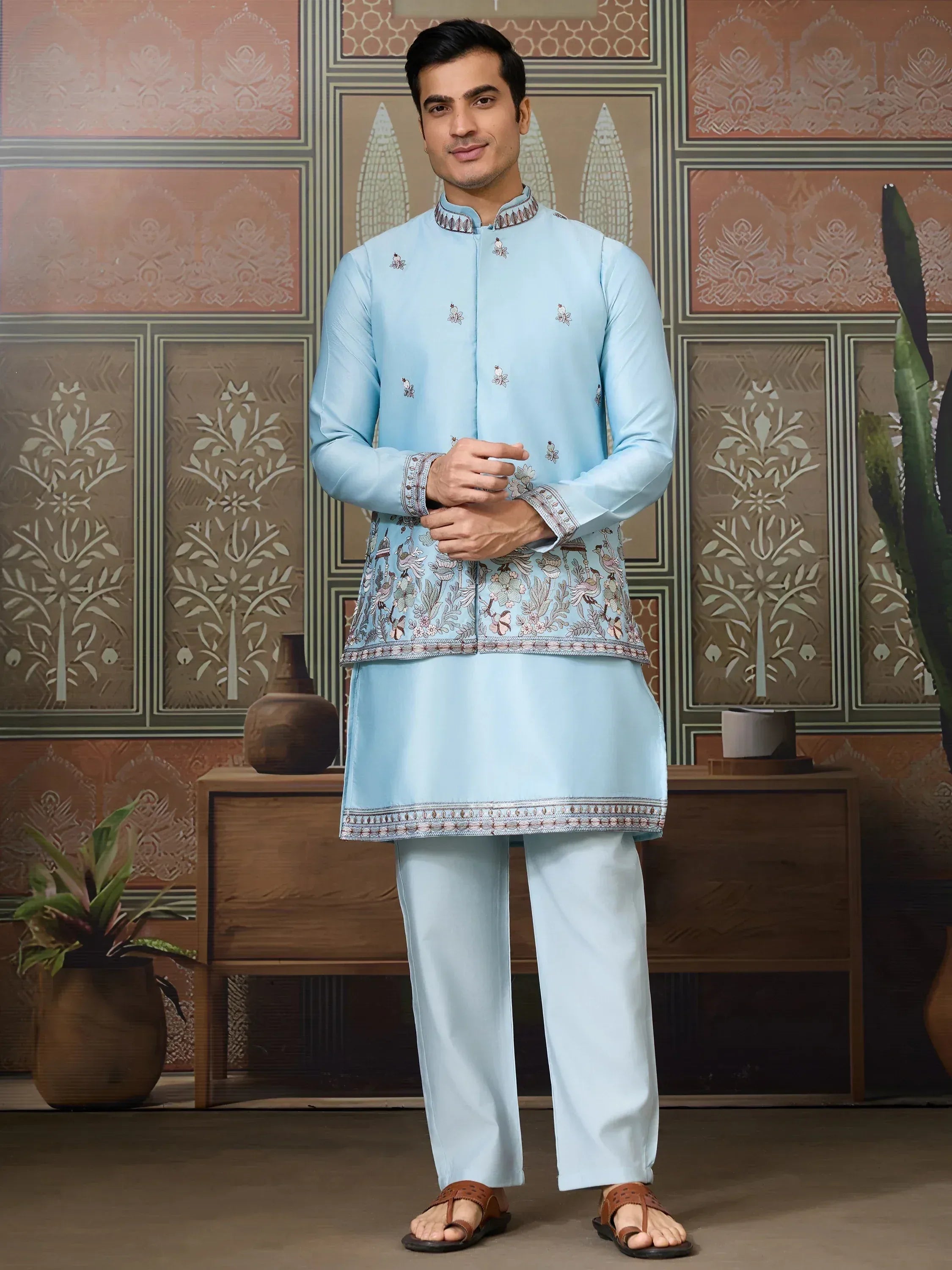 Light blue embroidered kurta pajama set with floral and bird motifs, perfect for Indian ethnic occasions.
