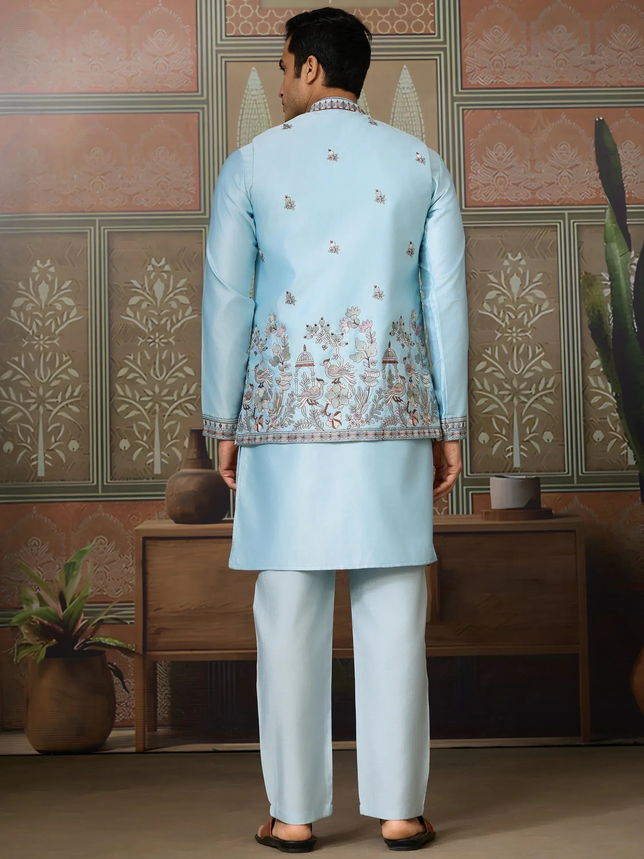 Light blue embroidered kurta pajama set with floral and bird motifs, ideal for Indian ethnic occasions