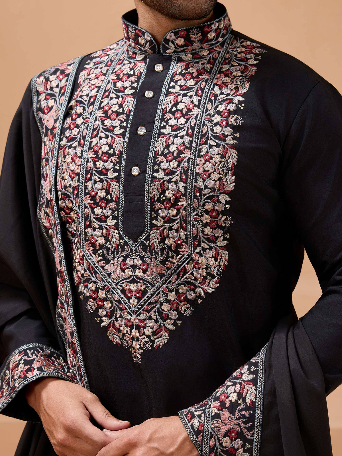 Black kurta with intricate floral embroidery for men, perfect for ethnic occasions and weddings.