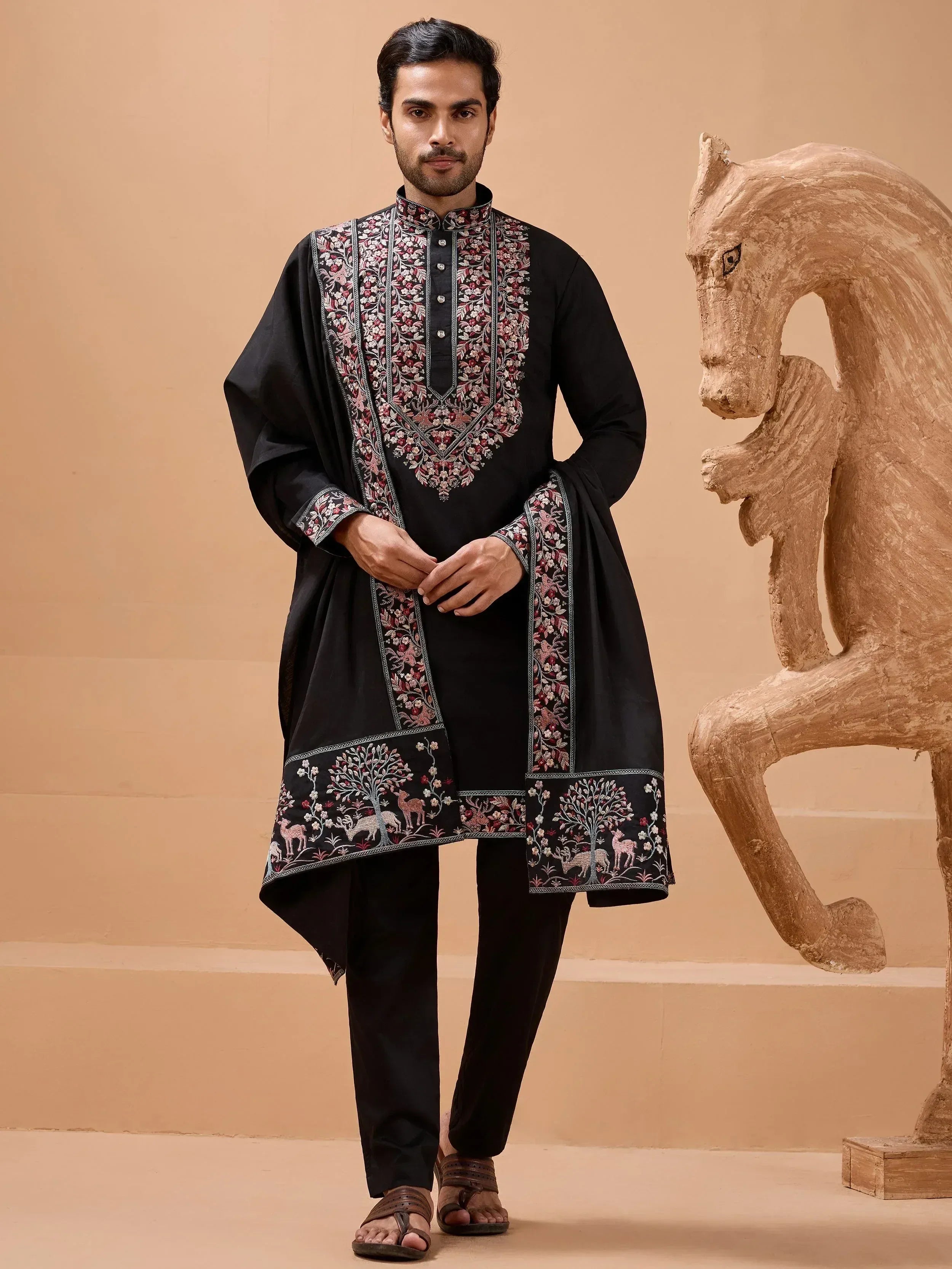 Black embroidered kurta set with floral and deer motifs, ideal for Indian ethnic occasions