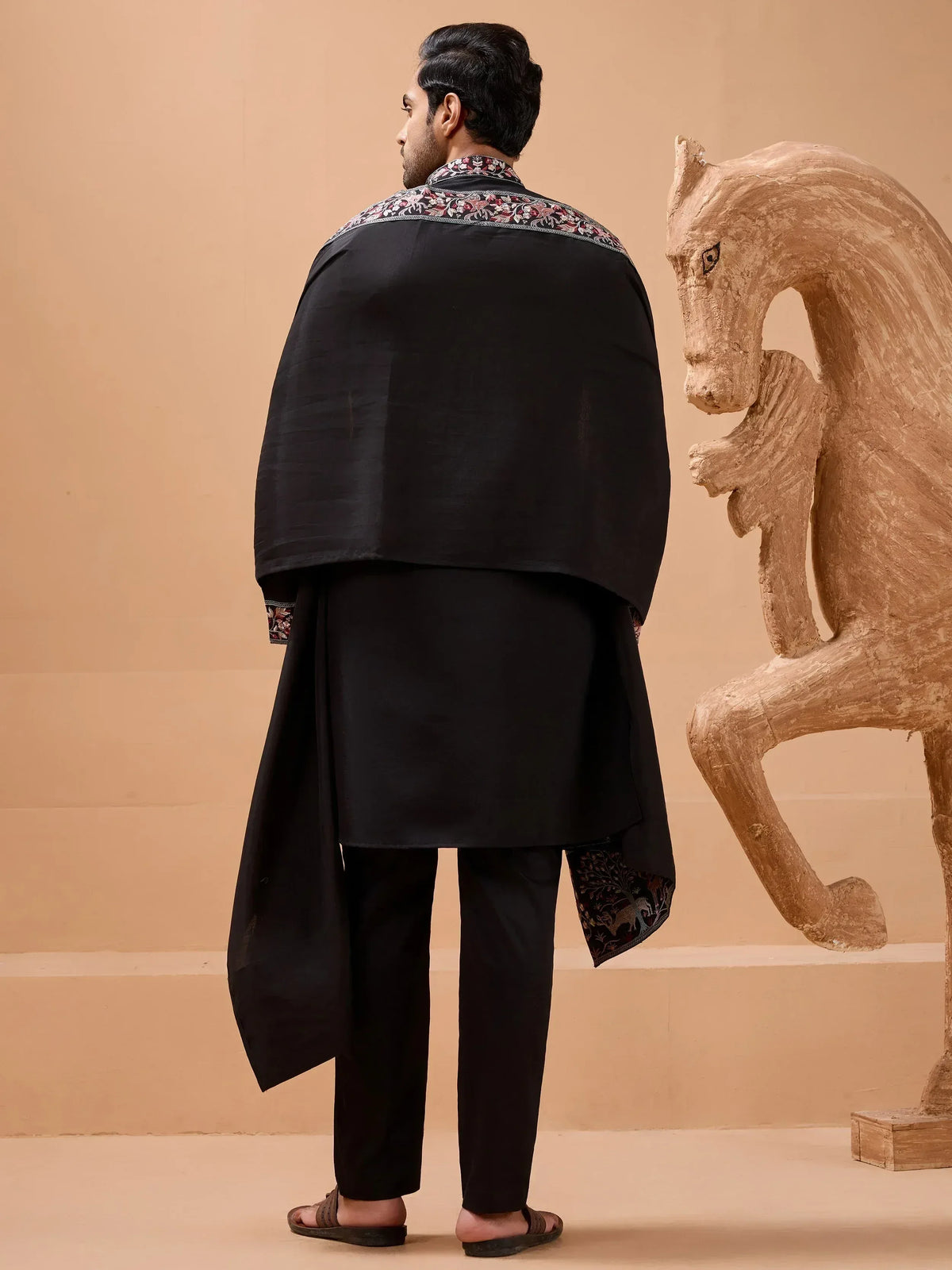 Man in black embroidered kurta set with floral detailing, ethnic wear for men