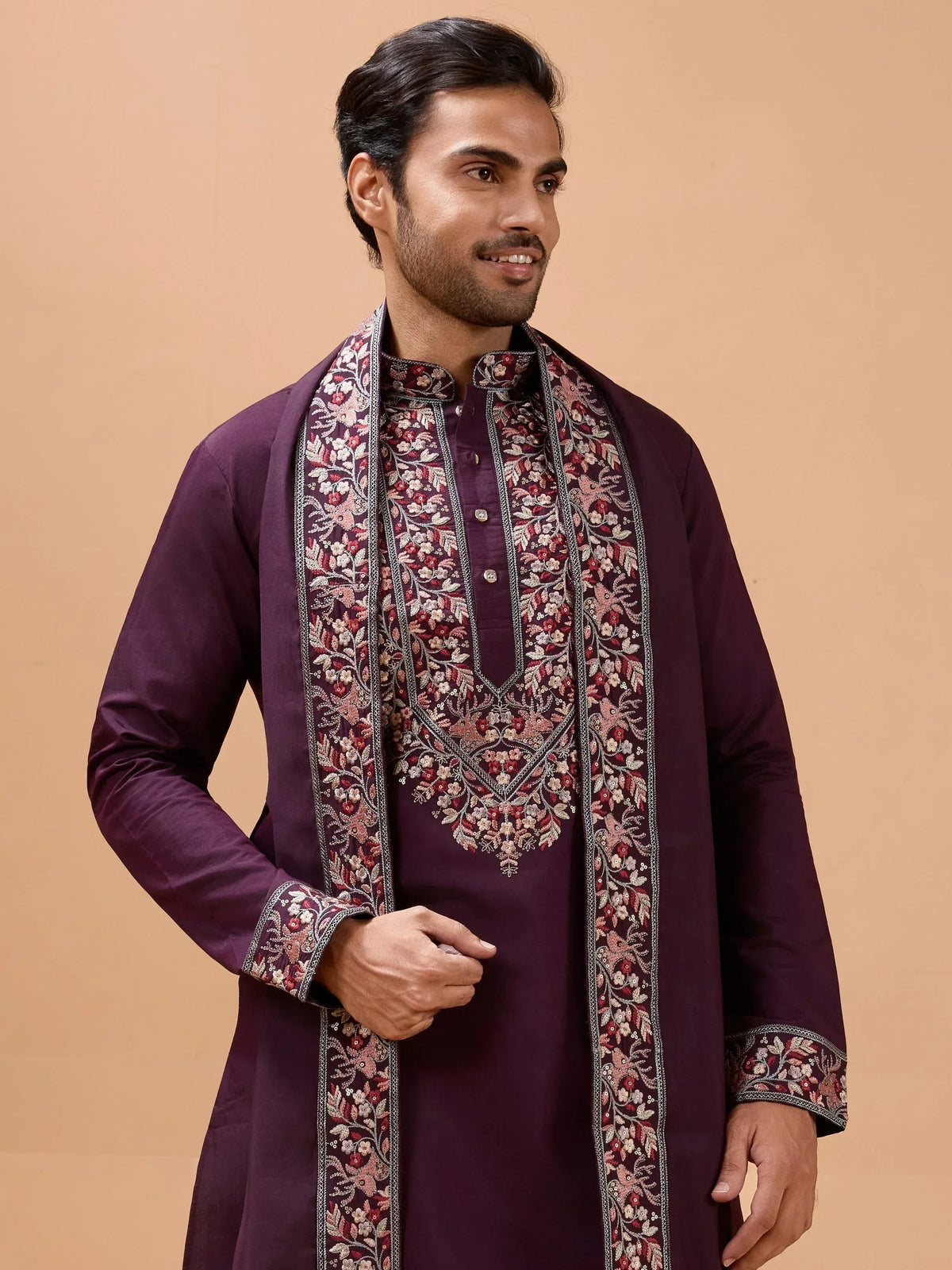 Man in purple embroidered kurta with floral detailing, Indian ethnic wear for men