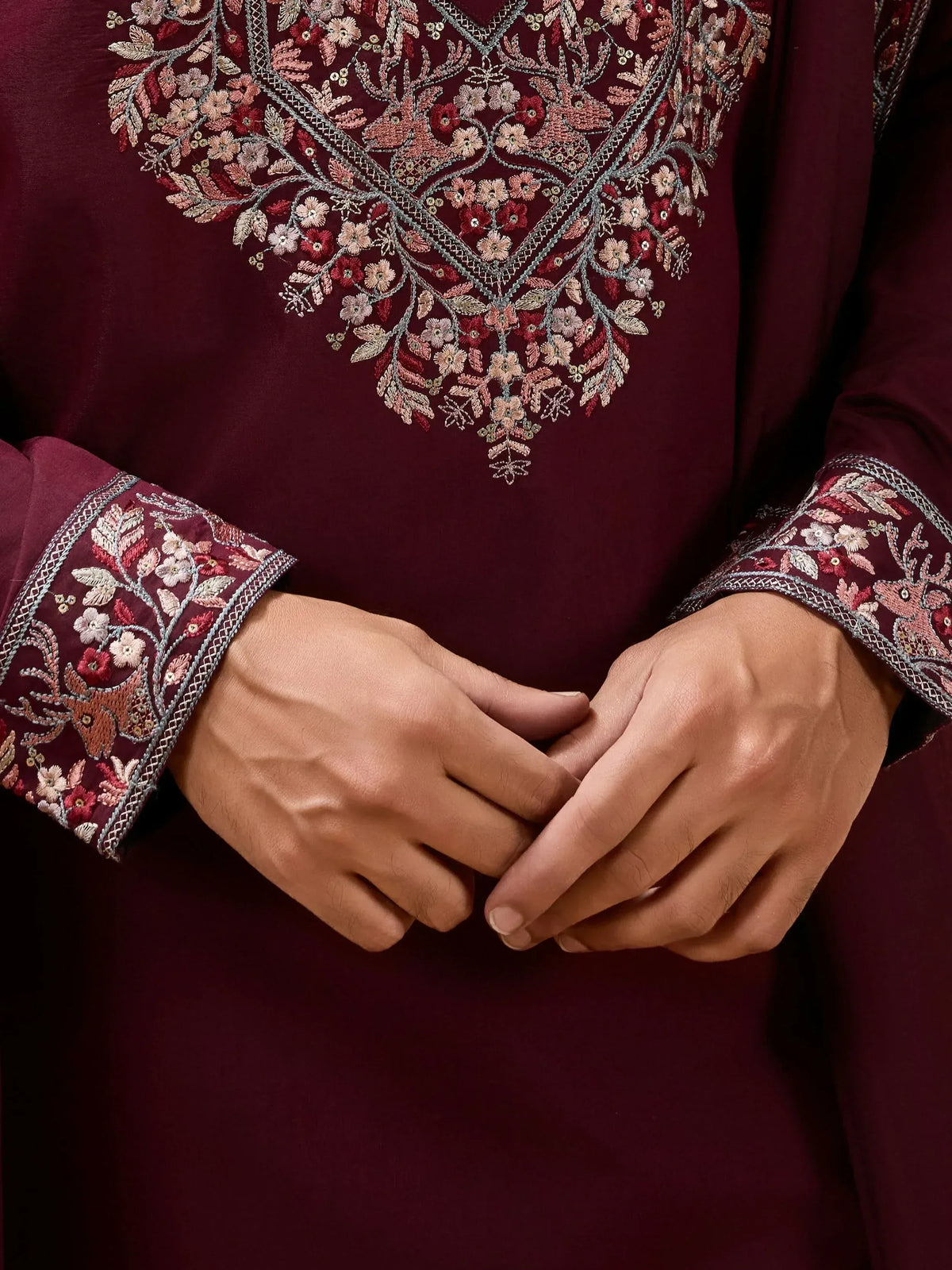 Maroon ethnic kurta with floral embroidery and detailed sleeve design
