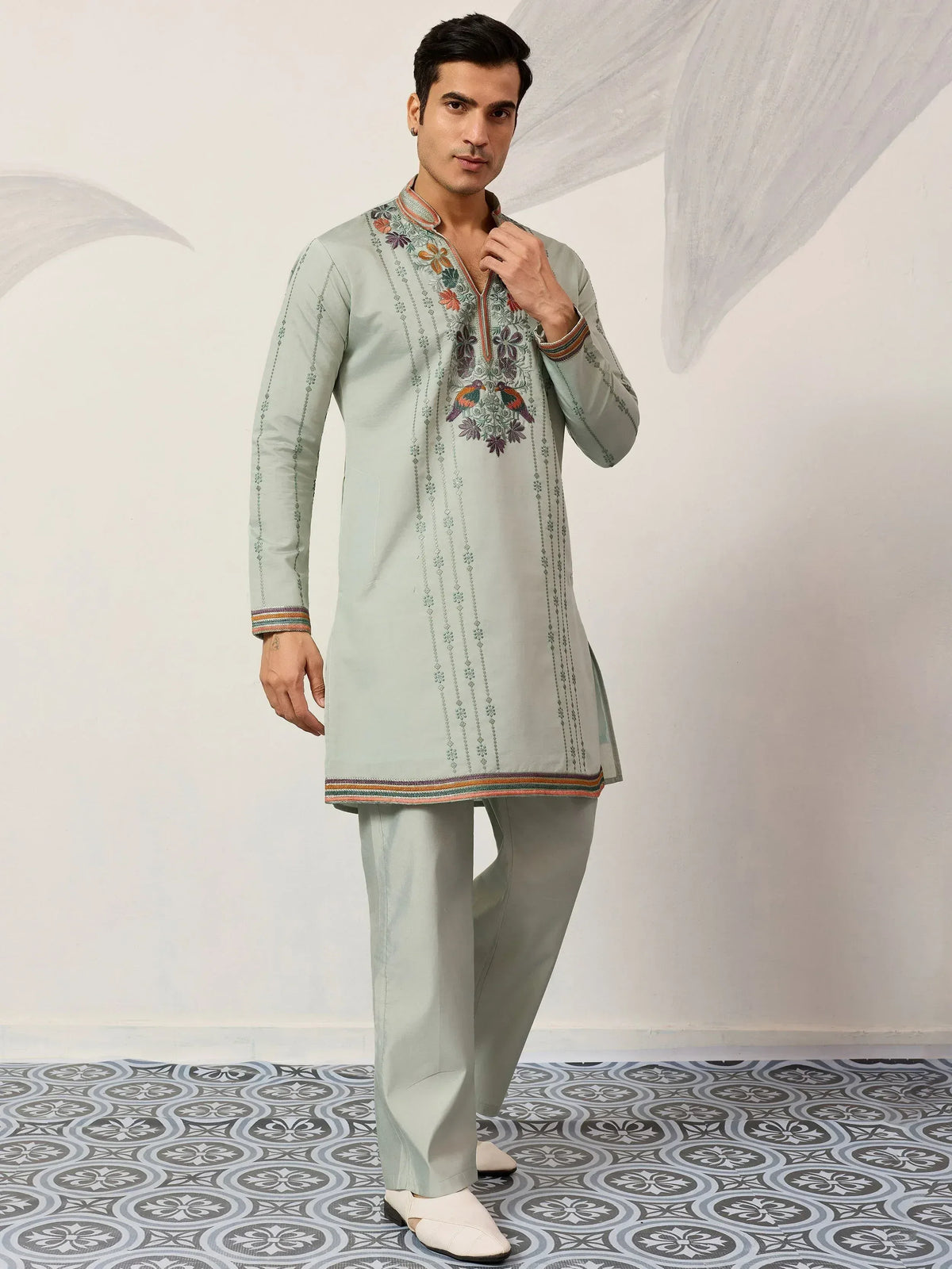 Mint green embroidered kurta pajama set with floral and bird motifs, perfect for Indian ethnic occasions.