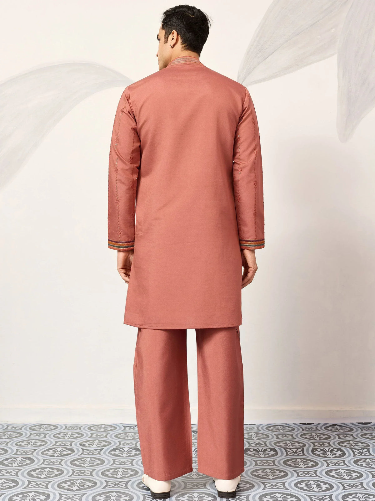 Men's dusty rose kurta pajama set with embroidered sleeves and striped cuffs, traditional Indian ethnic wear
