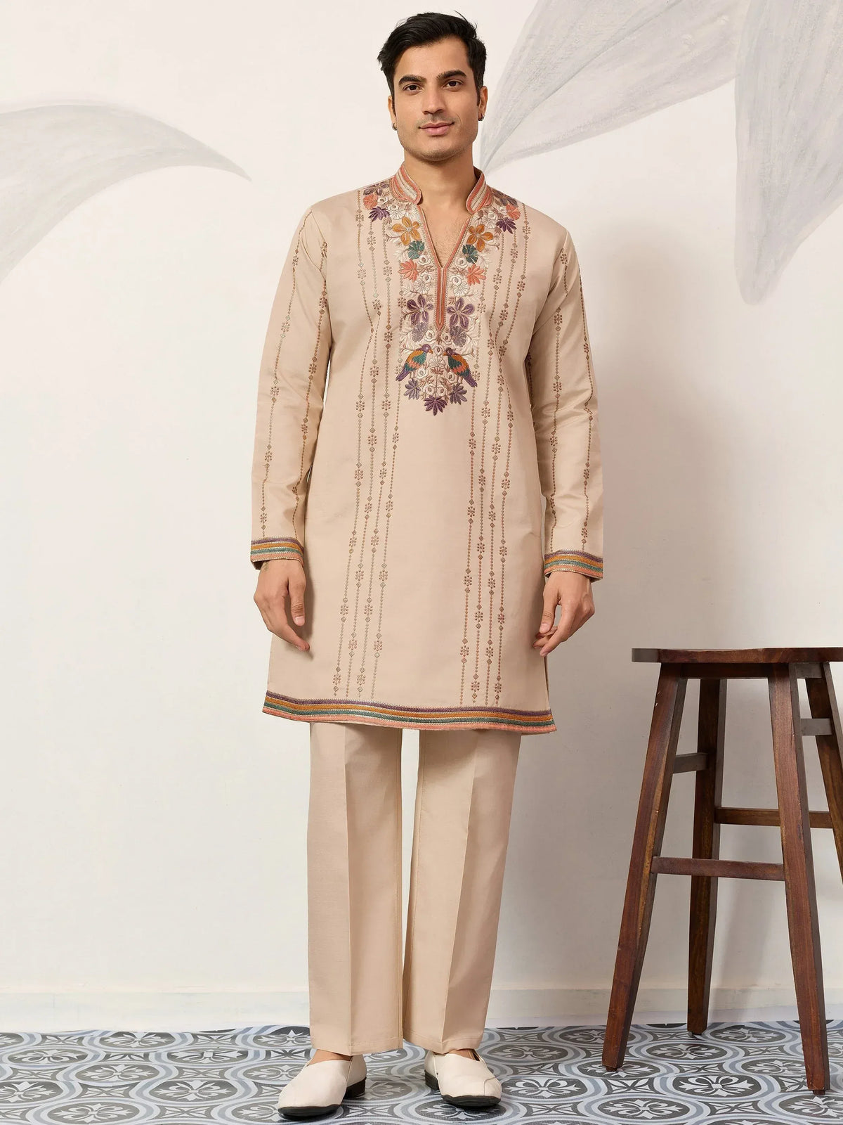 Beige embroidered kurta set with floral and bird motifs, perfect for ethnic occasions