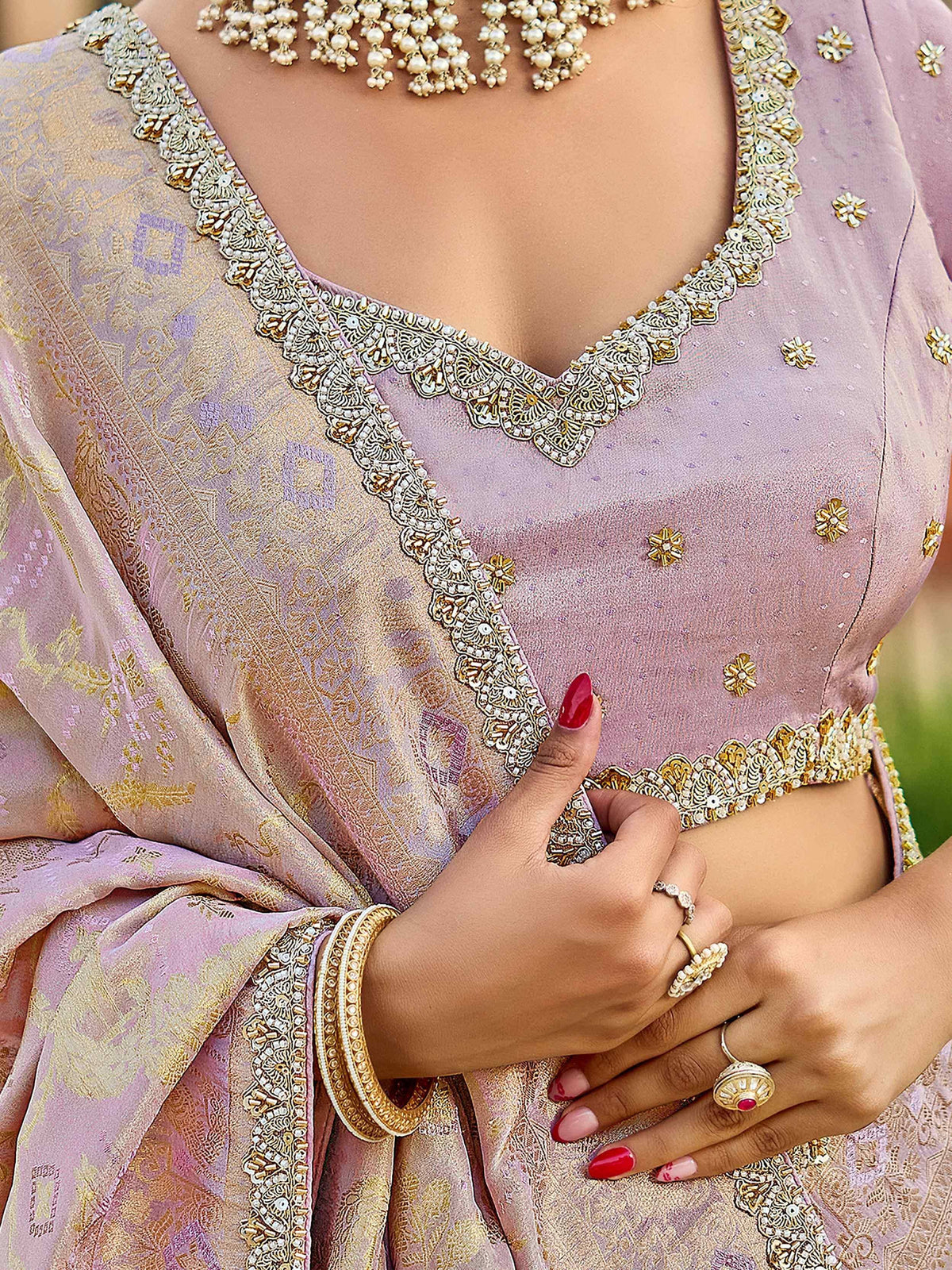 Lavender designer lehenga choli with gold embroidery, pearl detailing, and matching dupatta for Indian ethnic wear