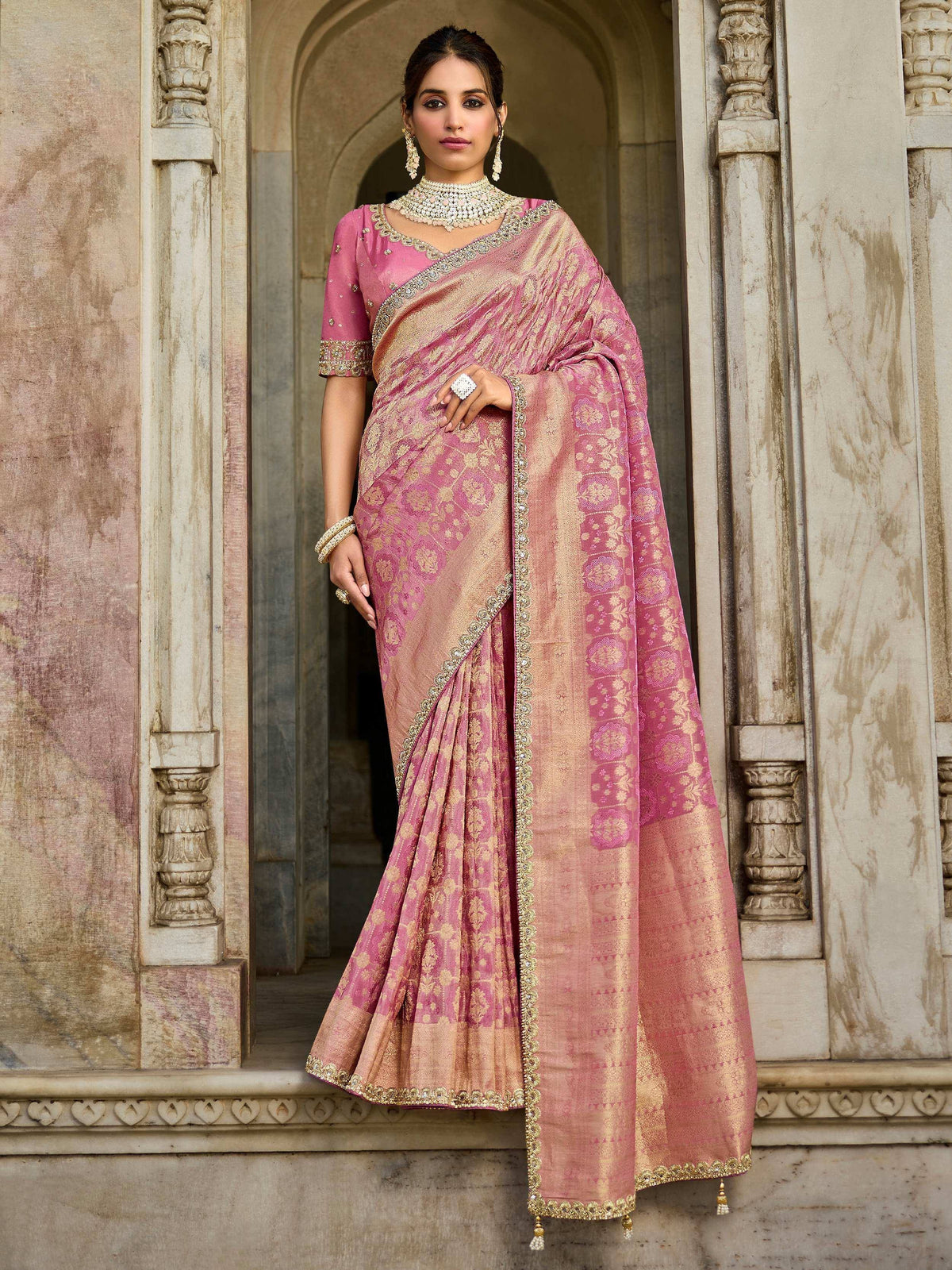 Elegant pink and gold embroidered saree with designer blouse, perfect for Indian ethnic occasions