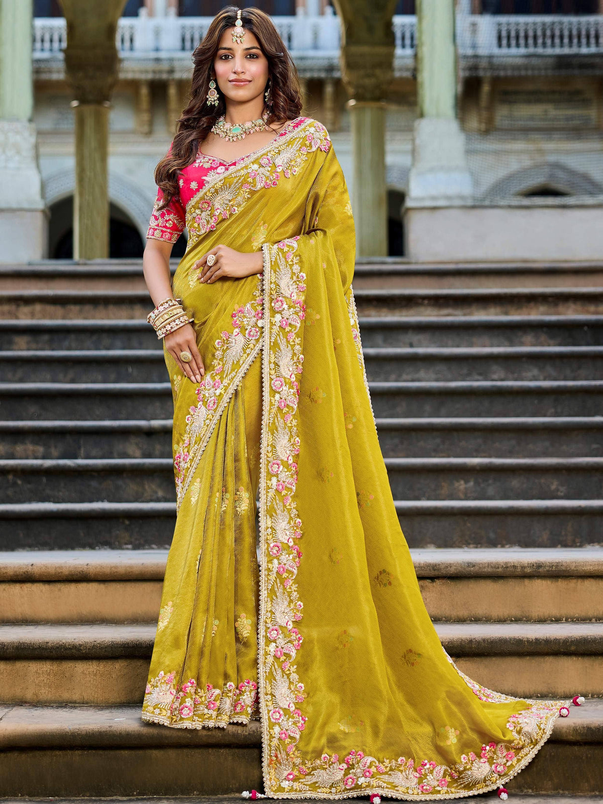 Yellow embroidered saree with pink floral work, perfect for Indian ethnic wear and festive occasions.
