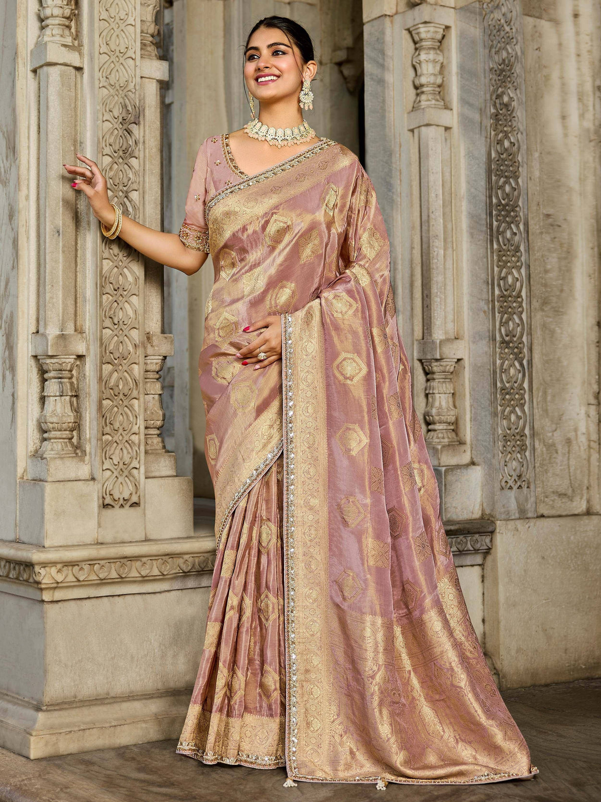 Elegant mauve and gold designer saree with intricate embroidery, perfect for Indian ethnic wear occasions.