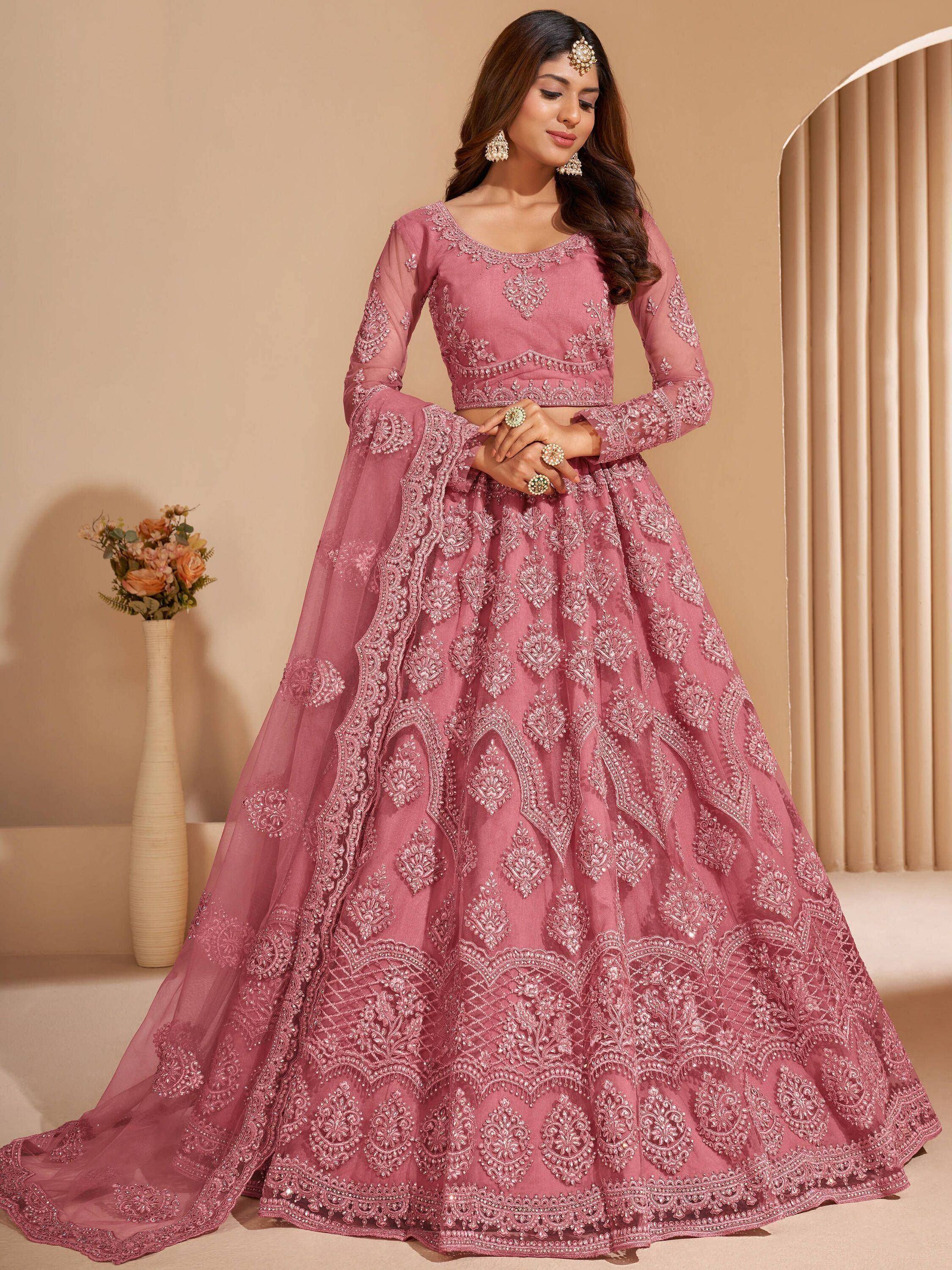 Dusty pink embroidered lehenga choli with sheer sleeves, perfect for Indian weddings and festive occasions.