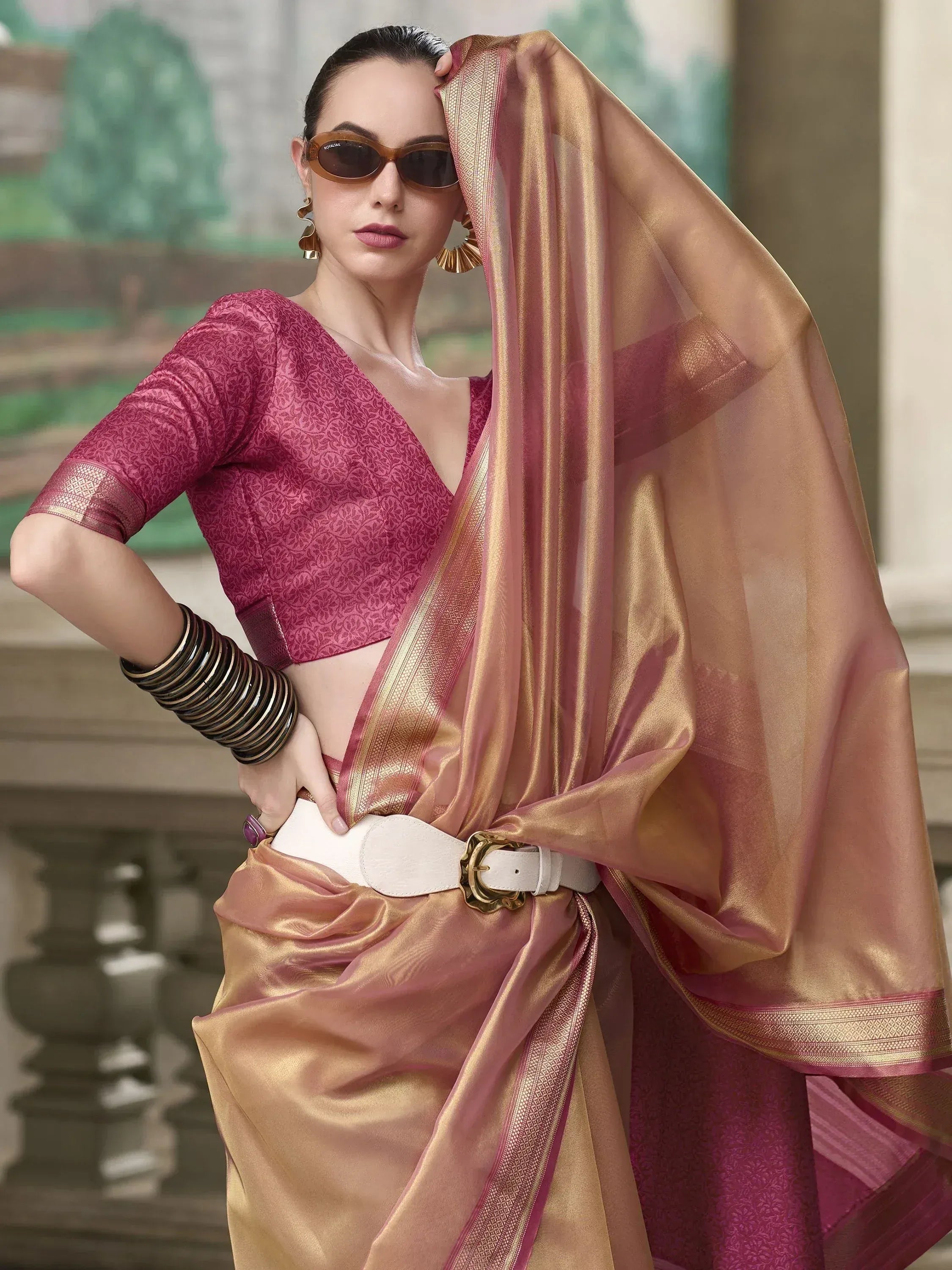 Woman in pink and gold saree with designer blouse, ethnic wear for festive occasions